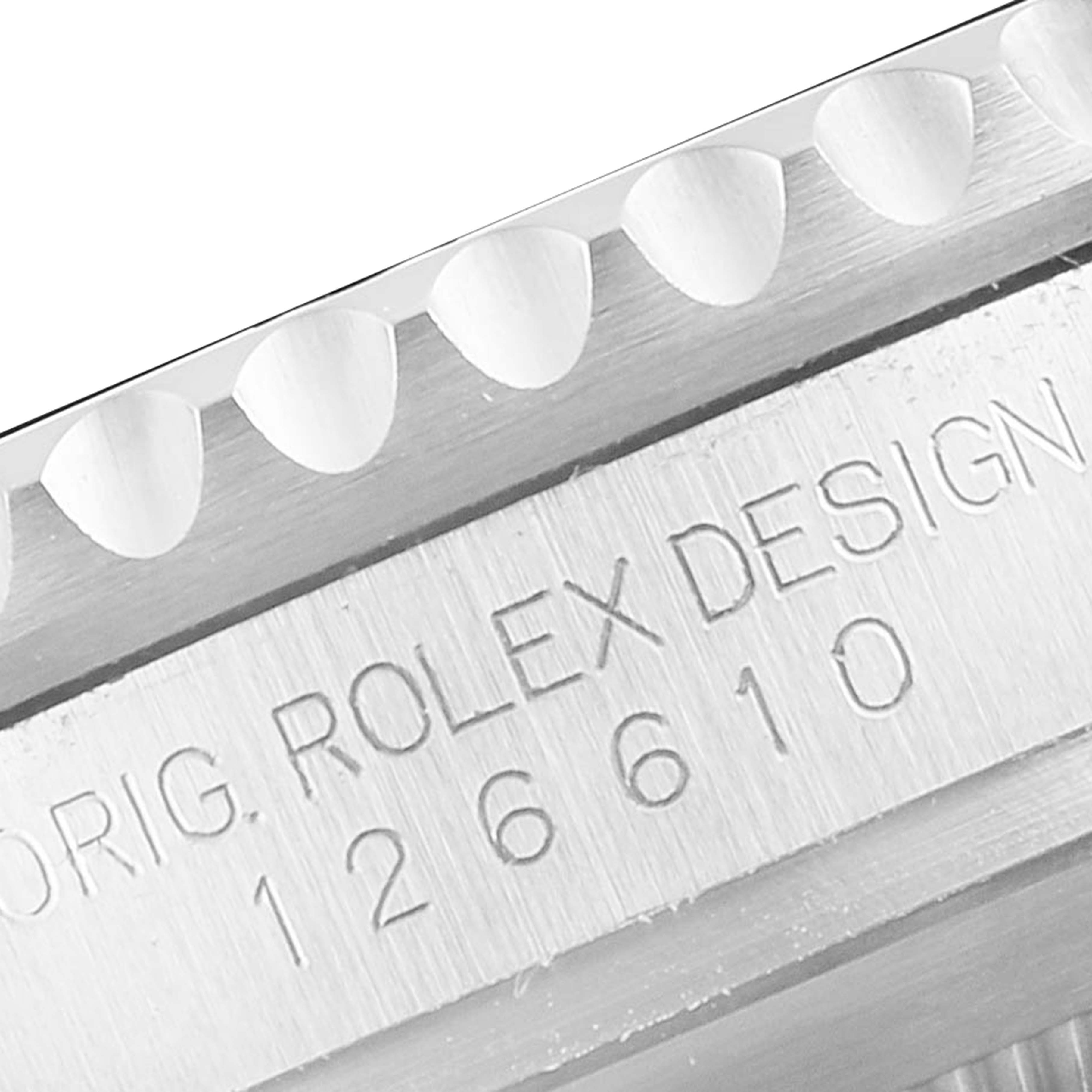 The image shows a close-up of the bezel and engraved serial number on the side of a Rolex Submariner 126610LN Men
s Stainless Steel Black Dial 126610LN Men
s Stainless Steel Black Dial watch.