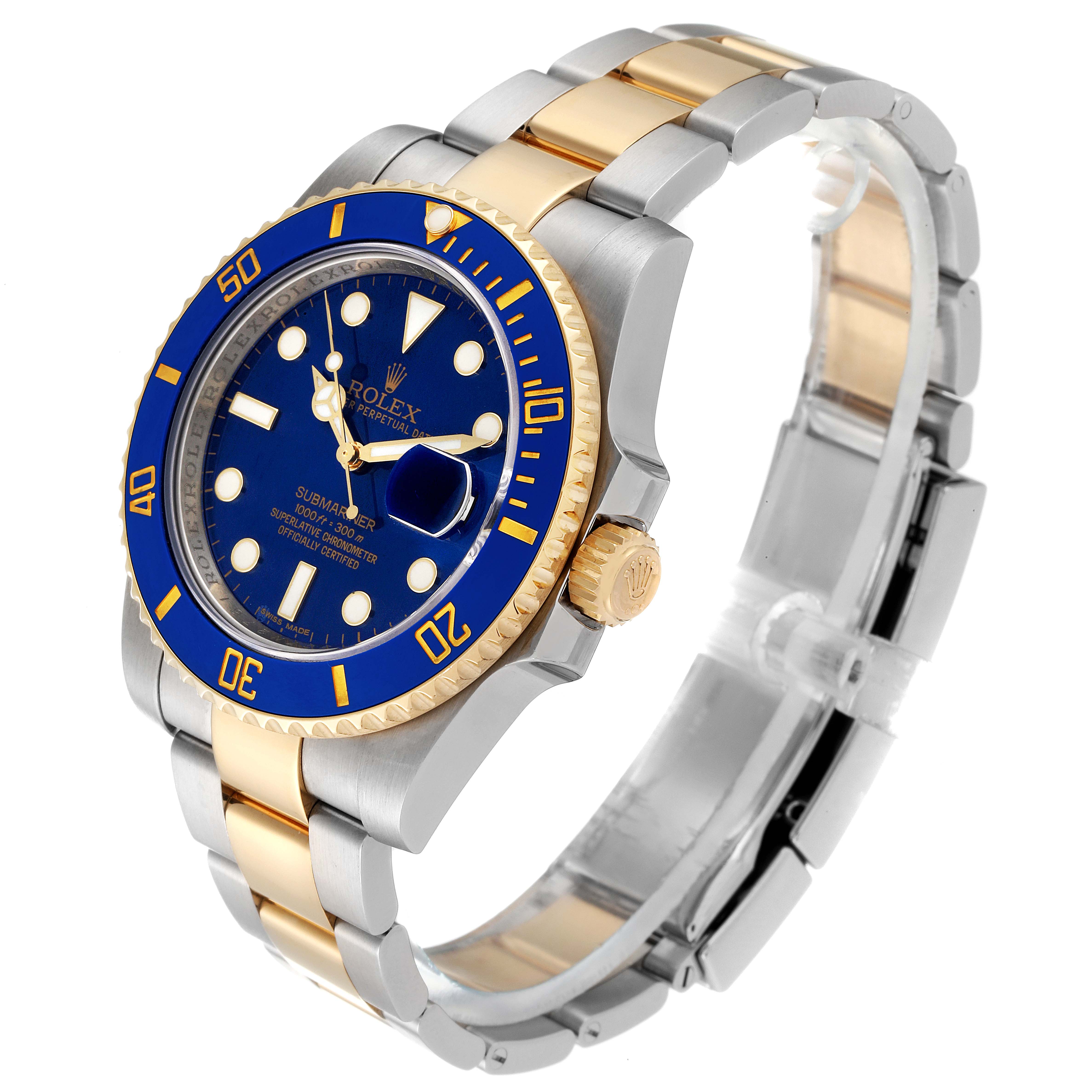 The image shows a Rolex Submariner 116613 Men
s Steel and Gold (two tone) Blue Dial 116613 Men
s Steel and Gold (two tone) Blue Dial watch at an angle highlighting its blue dial, bezel, two-tone bracelet, and crown.