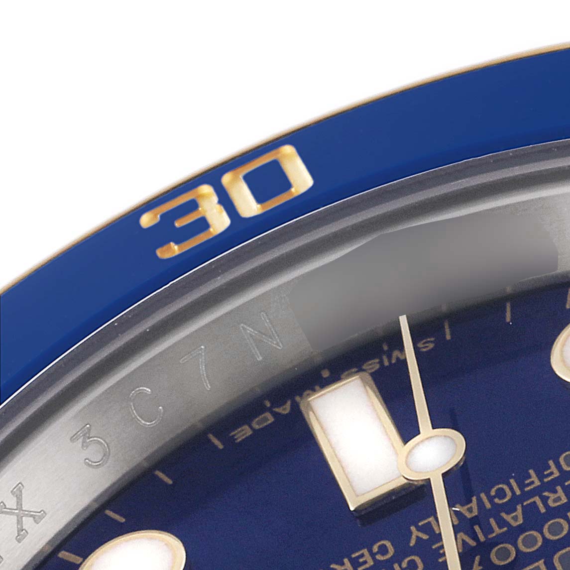 This close-up angle shows the bezel, part of the dial, and watch hands of the Rolex Submariner 116613 Men
s Steel and Gold (two tone) Blue Dial 116613 Men
s Steel and Gold (two tone) Blue Dial.