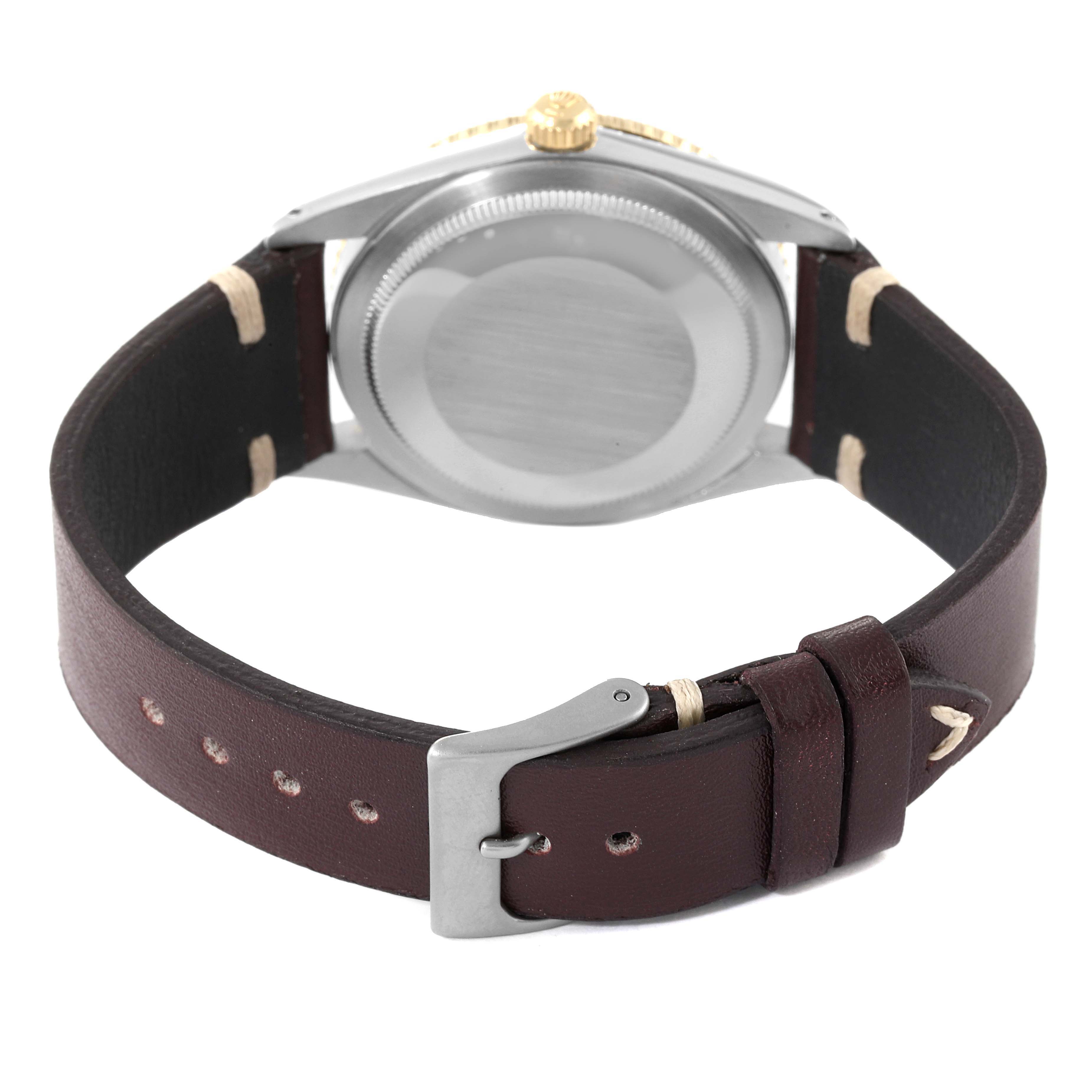 This image shows the back casing and leather strap buckle of a Vintage Collection model watch by Rolex.