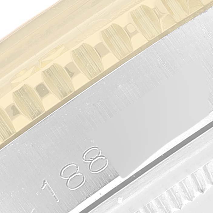 This close-up image of the Rolex Vintage Collection 1625 Men's Steel and Gold (two tone) Silver Dial 1625 Men's Steel and Gold (two tone) Silver Dial watch shows part of the bezel and case, highlighting its detailed craftsmanship.