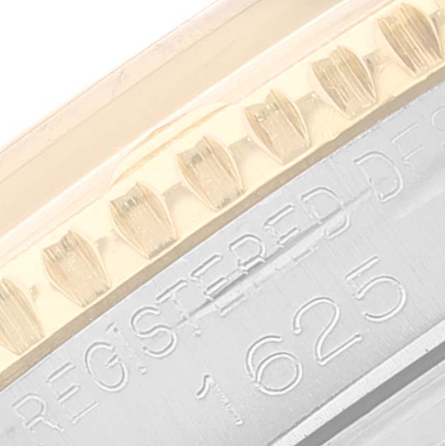 This shows a close-up of the bezel and engraved serial number of the Rolex Vintage Collection 1625 Men's Steel and Gold (two tone) Silver Dial 1625 Men's Steel and Gold (two tone) Silver Dial watch.