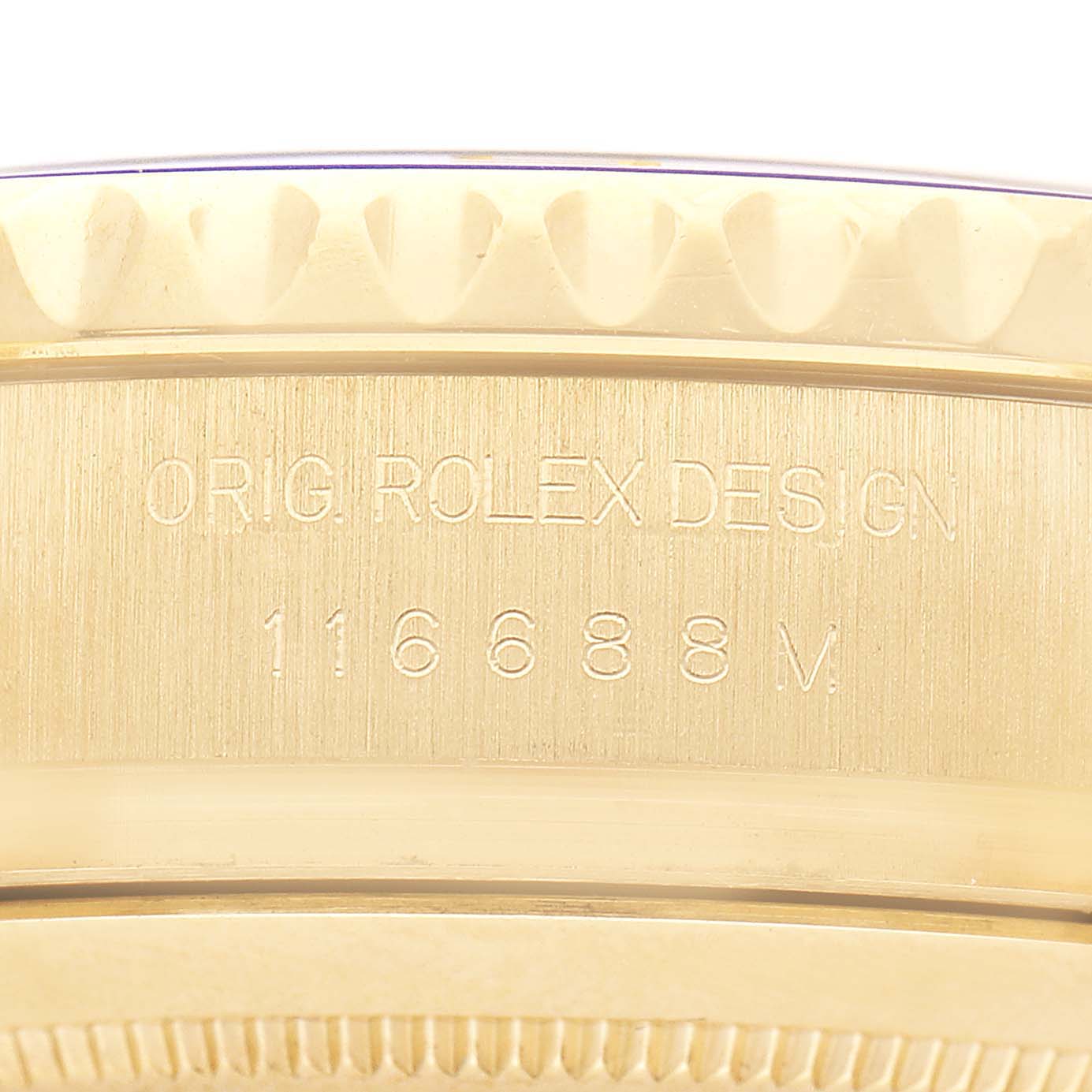 The image shows a close-up of the Rolex Yacht-Master 116688 Men's Yellow Gold White Dial's engraved side, displaying "ORIG ROLEX DESIGN" and the model number 116688.