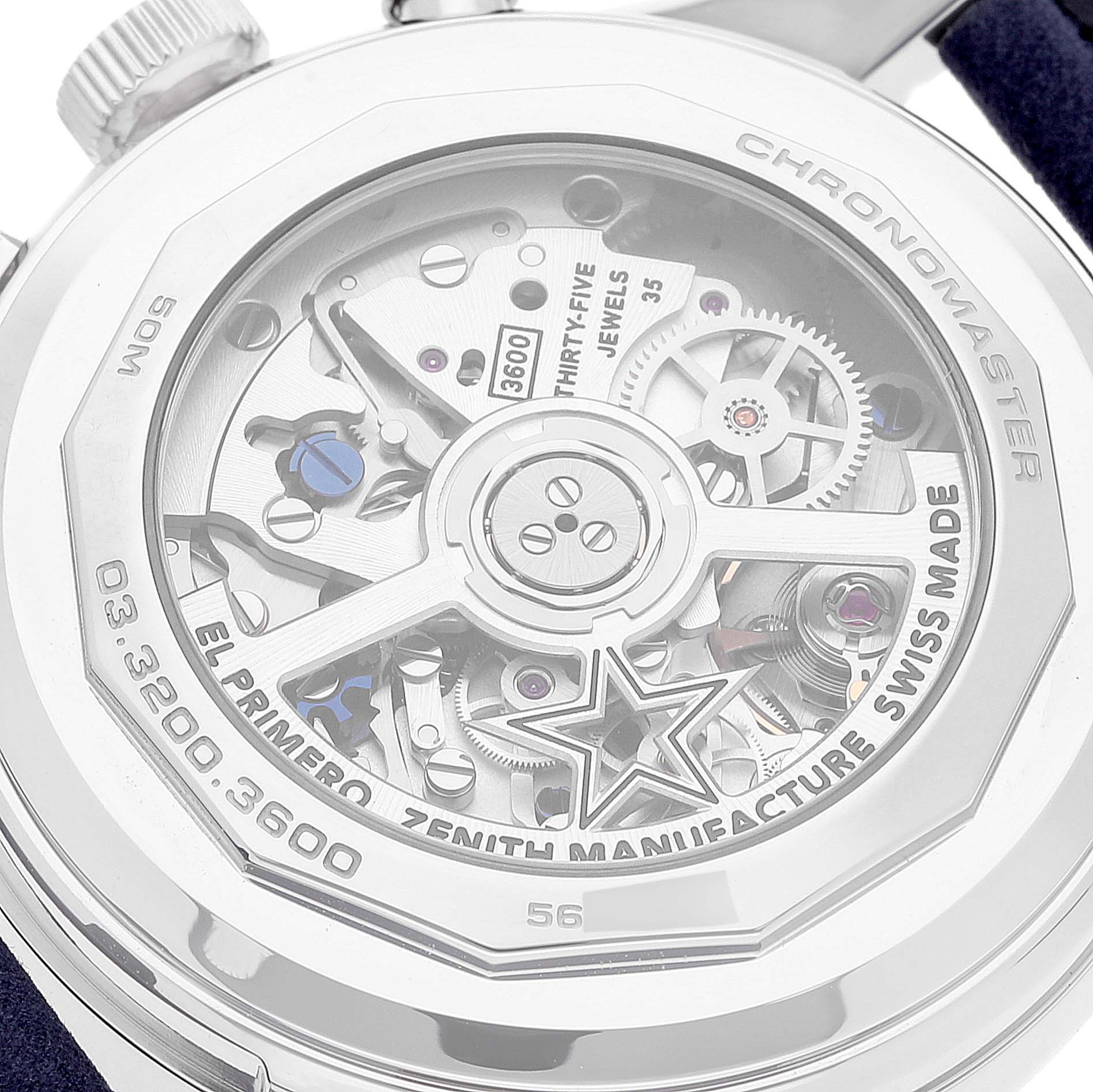 The image shows the back of a Zenith Chronomaster 03.3200.3600 Men
s Stainless Steel White Dial 03.3200.3600 Men
s Stainless Steel White Dial watch, highlighting its intricate movement mechanism and engravings.
