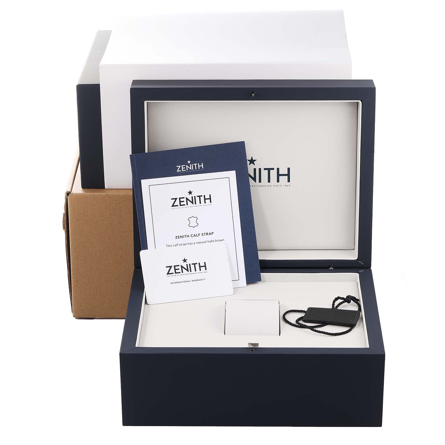 The image shows accessories and packaging for the Zenith Chronomaster 03.3200.3600 Men
s Stainless Steel White Dial 03.3200.3600 Men
s Stainless Steel White Dial, including booklets, tags, and an open watch box.