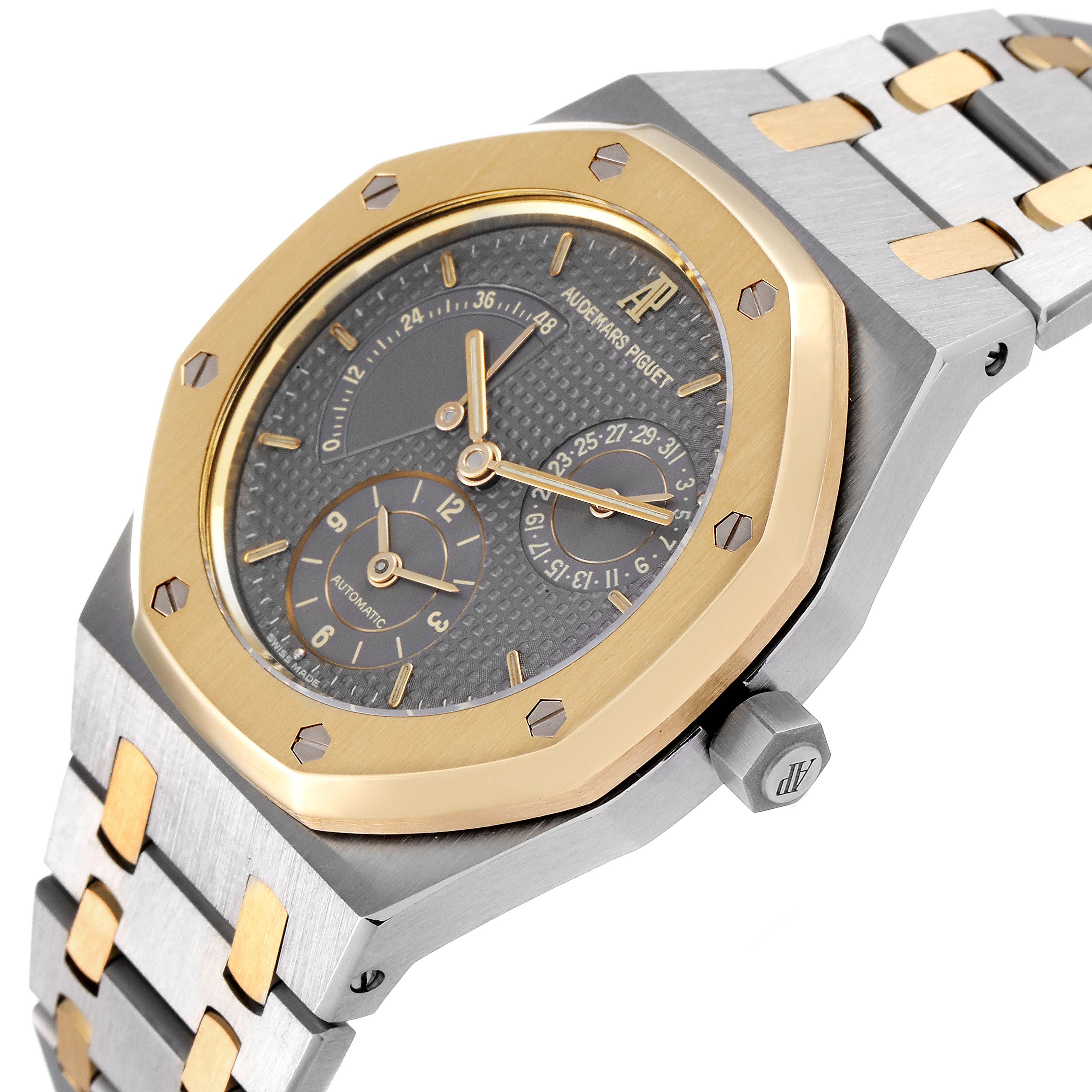 This image shows a tilted angle of the Audemars Piguet Royal Oak 25730SA.01.078 Men
s Steel and Gold (two tone) Silver Dial 25730SA.01.078 Men
s Steel and Gold (two tone) Silver Dial watch, highlighting its dial, bezel, and part of the bracelet.