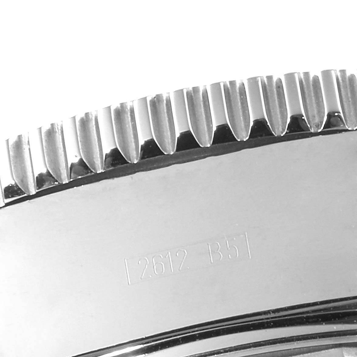 The image shows a close-up of the bezel and part of the engraved serial number of a Breitling Superocean C13341 Men's Steel and Gold (two tone) Black Dial C13341 Men's Steel and Gold (two tone) Black Dial watch.