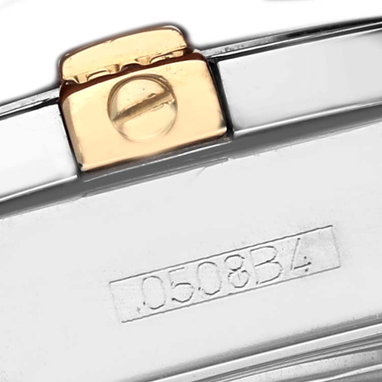 The image shows a close-up of the clasp and engraved serial number on a Breitling B71356 Women
s Steel and Gold (two tone) Orange Dial Cockpit Steel Bronze Diamond Bezel Dial Ladies Watch B71356.