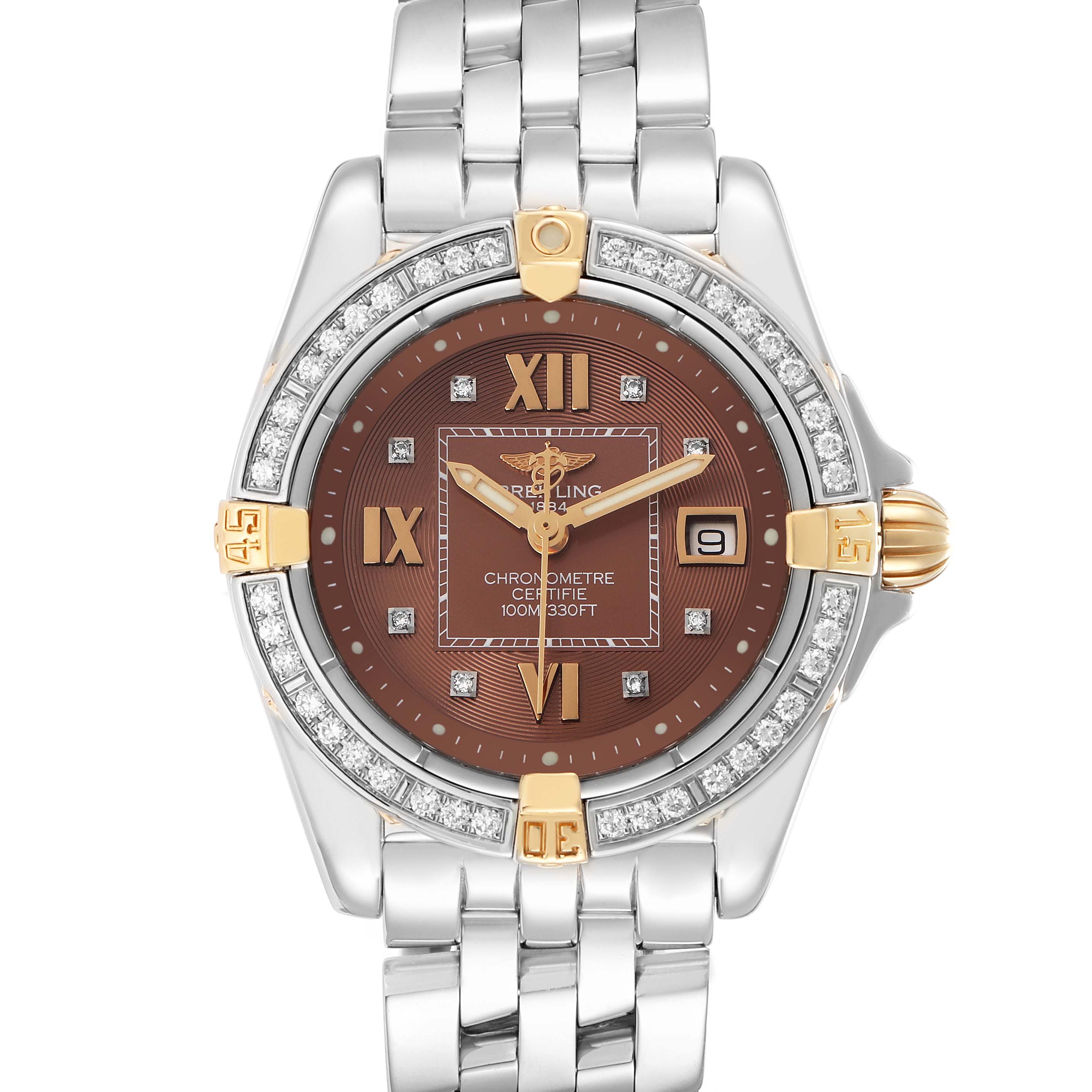 The Breitling B71356 Women
s Steel and Gold (two tone) Orange Dial Cockpit Steel Bronze Diamond Bezel Dial Ladies Watch B71356 is shown from a top-down angle, displaying the watch face and bracelet.