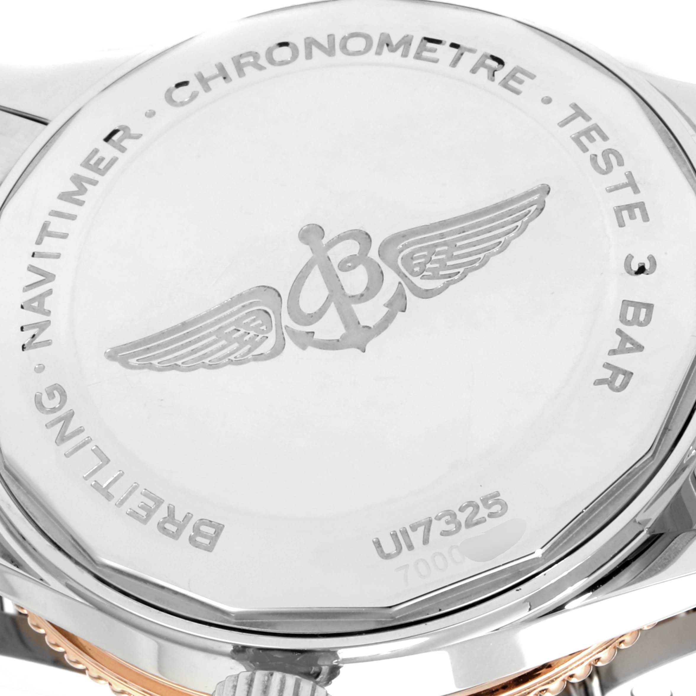 The image shows the back casing of a Breitling Navitimer U17325211G1A1 Men's Stainless Steel Silver Dial U17325211G1A1 Men's Stainless Steel Silver Dial watch, displaying the model number and logo.