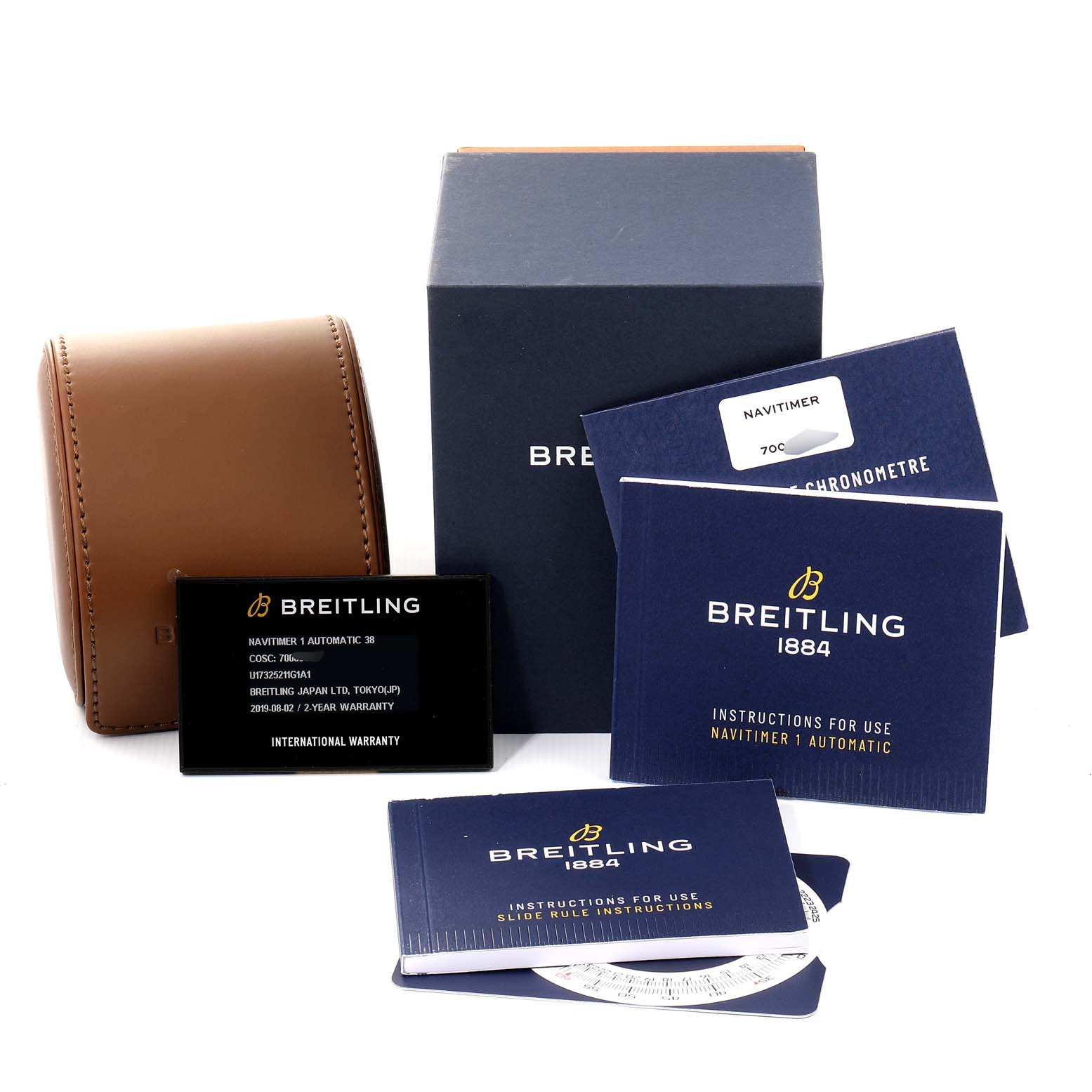 The image shows packaging and accessories for a Breitling Navitimer U17325211G1A1 Men's Stainless Steel Silver Dial U17325211G1A1 Men's Stainless Steel Silver Dial watch, including a box, watch pouch, warranty card, and instruction manuals.