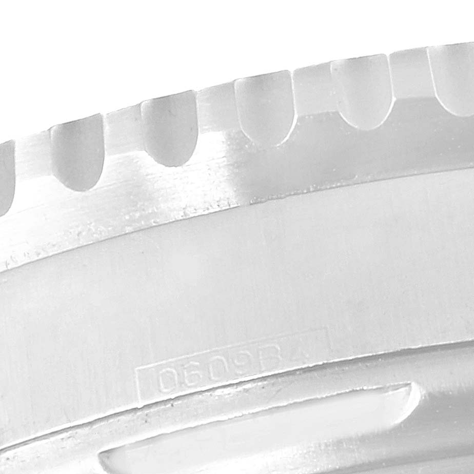 This image shows a close-up of the bezel teeth on a Breitling Navitimer A23322 Men's Stainless Steel Silver Dial A23322 Men's Stainless Steel Silver Dial watch.