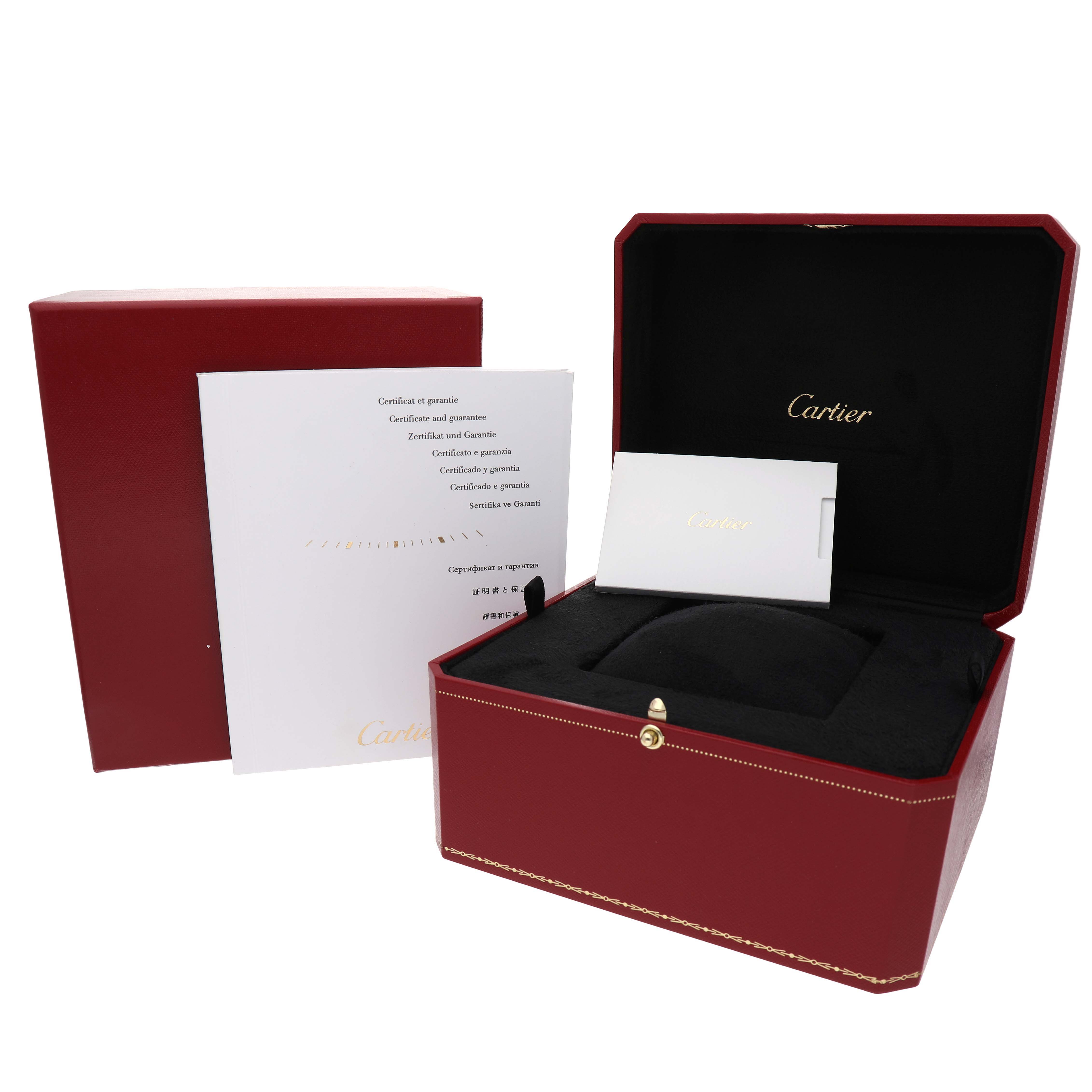The image shows the Cartier Baignoire W8000007 Women's Yellow Gold Silver Dial watch box, open, displaying the branded interior and accompanying documents.