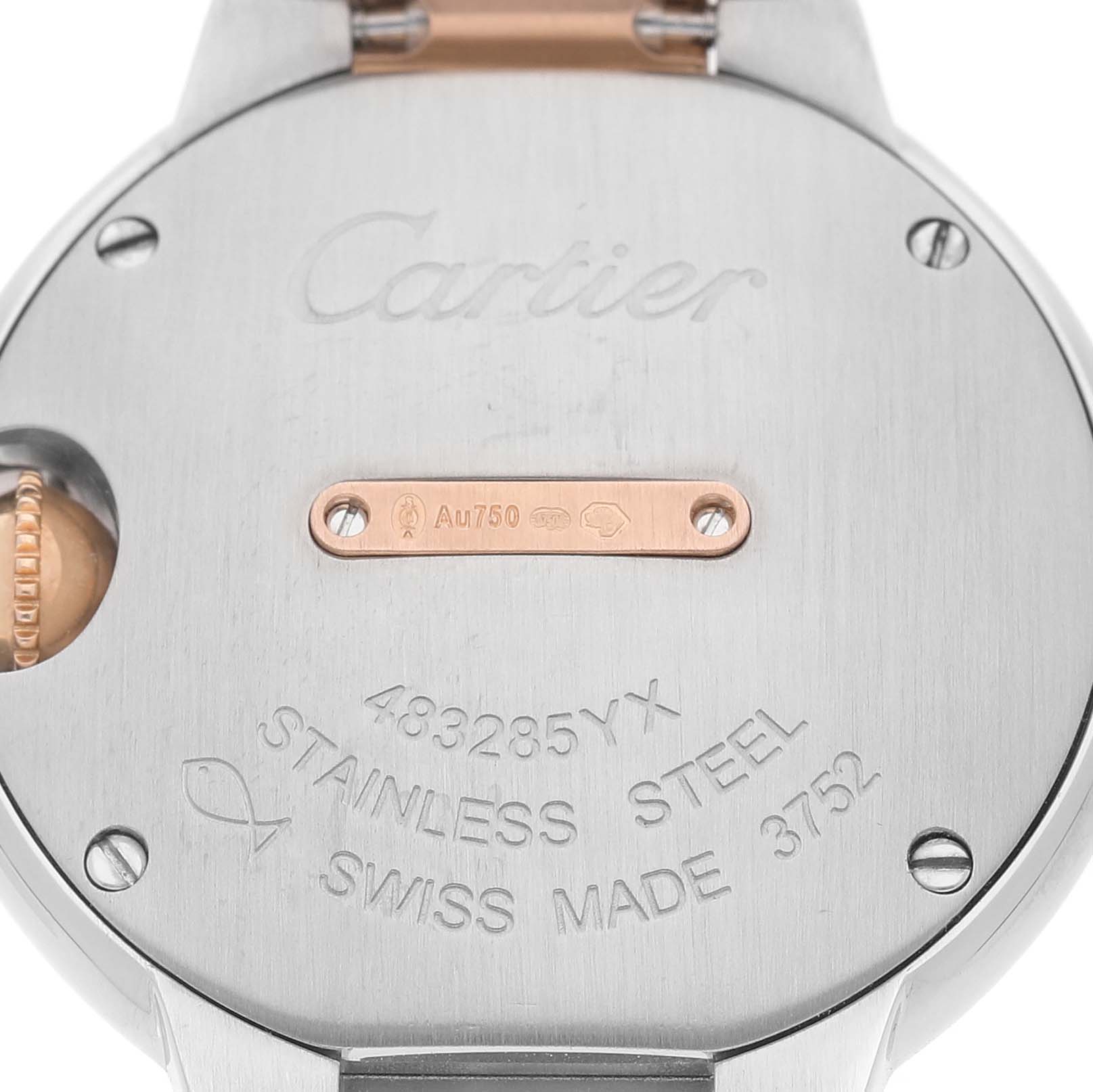 The image shows the back of a Cartier Ballon Bleu W3BB0005 Women's Steel and Gold (two tone) Silver Dial watch with its engravings visible, including the serial number and material details.