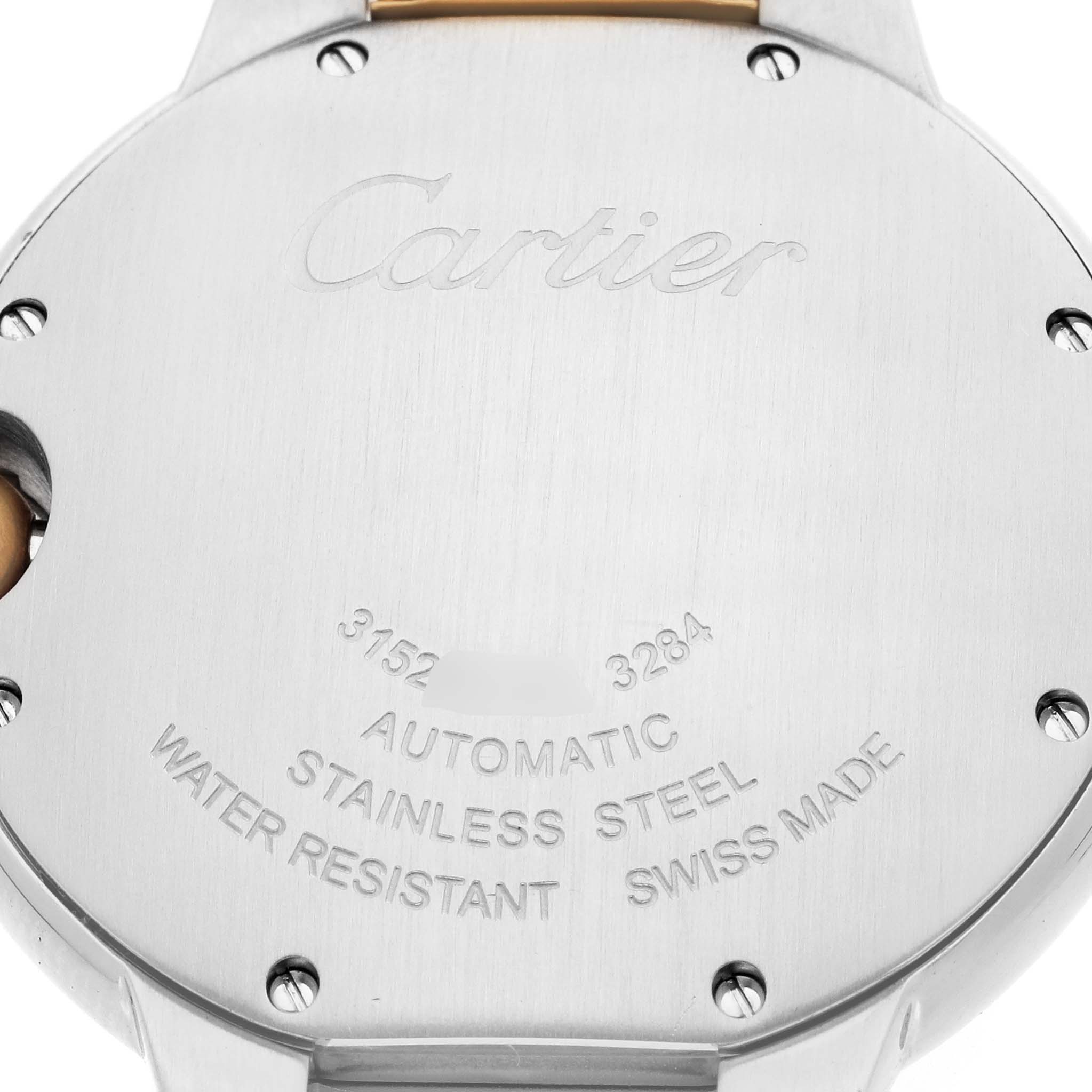 The image shows the back of a Cartier Ballon Bleu W2BB0012 Men
s Steel and Gold (two tone) Silver Dial watch, highlighting the engraving and screws.