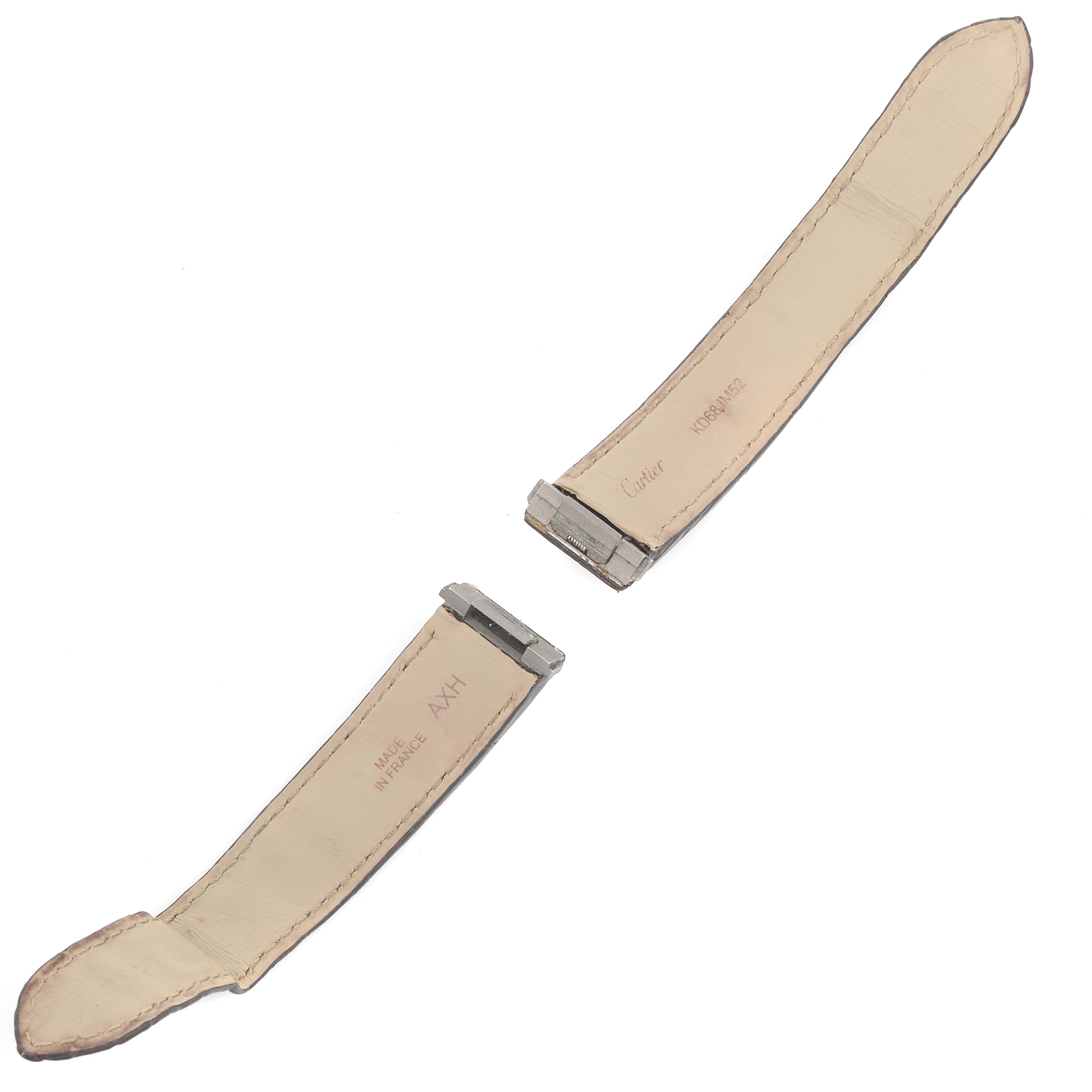 This image displays the leather straps for a Cartier Roadster W62025V3 Men's Stainless Steel Silver Dial W62025V3 Men's Stainless Steel Silver Dial watch, with metal attachments and brand inscriptions visible.