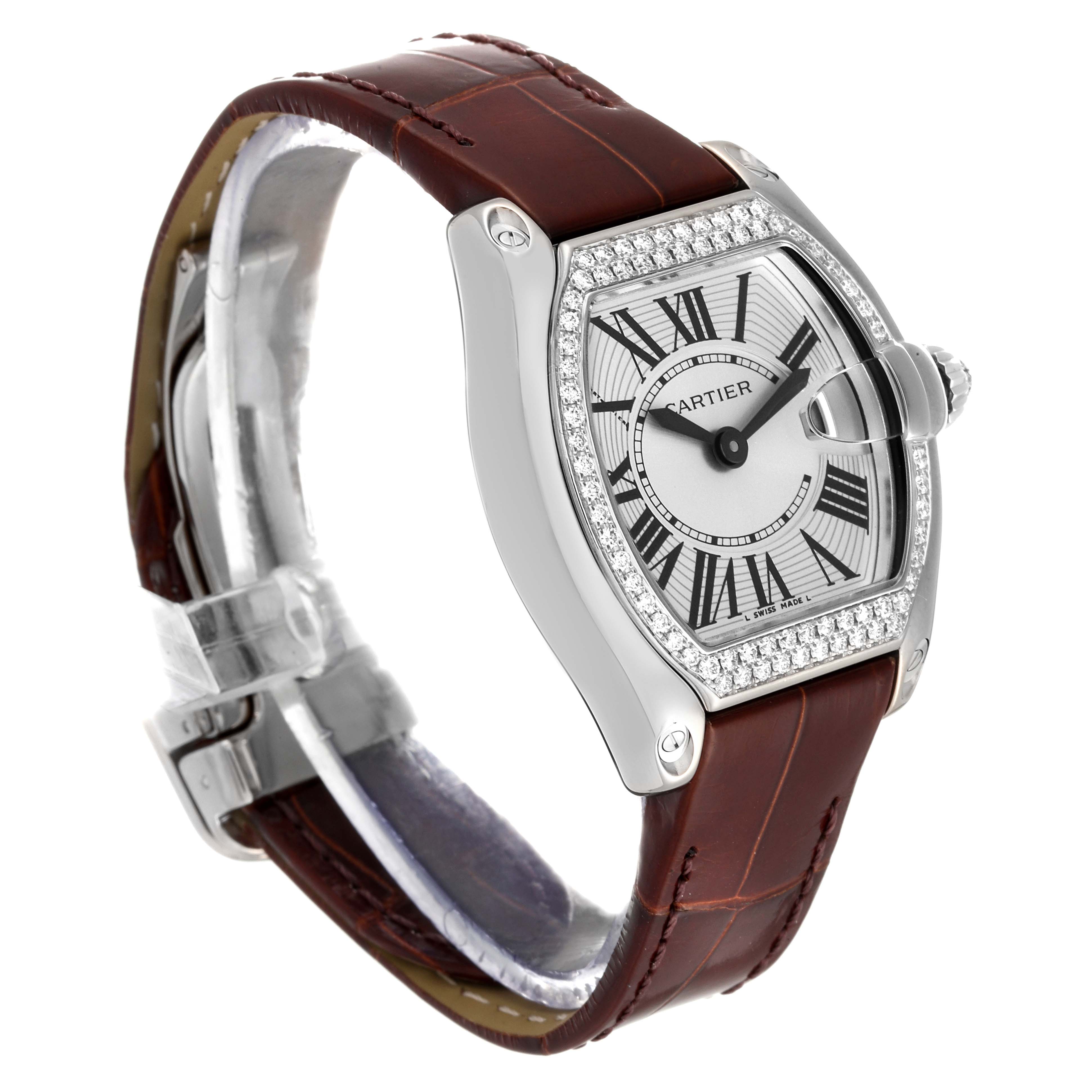 The Cartier Roadster WE500260 Women's White Gold Silver Dial WE500260 Women's White Gold Silver Dial watch is shown at a slight angle displaying its face, bezel, crown, and leather strap.
