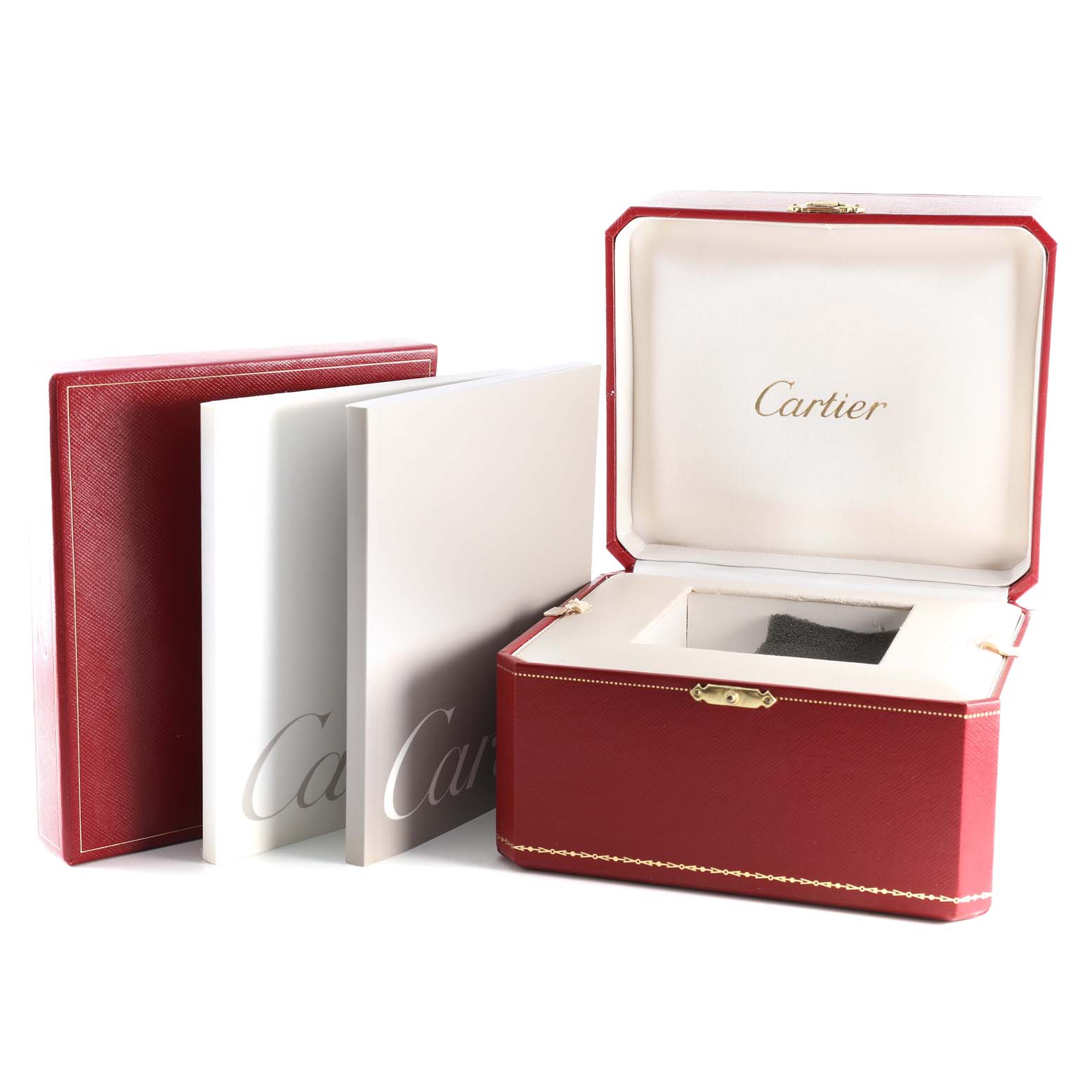 The image shows the box and manuals for a Roadster model by Cartier, all placed at an angle where the interiors are visible.