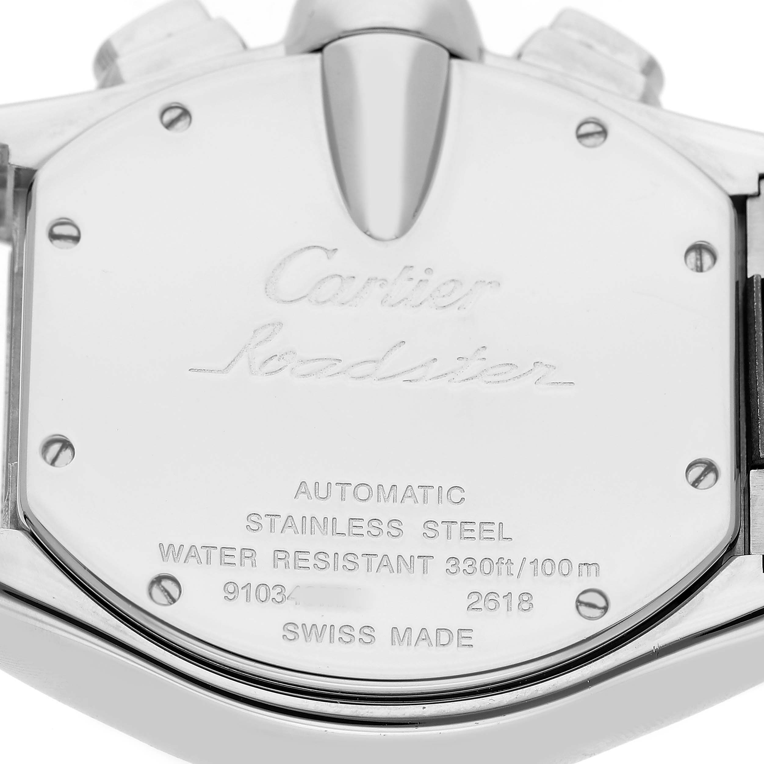 The image shows the back case of the Cartier Roadster W62019X6 Men's Stainless Steel Silver Dial watch, featuring engraved specifications and the brand logo.