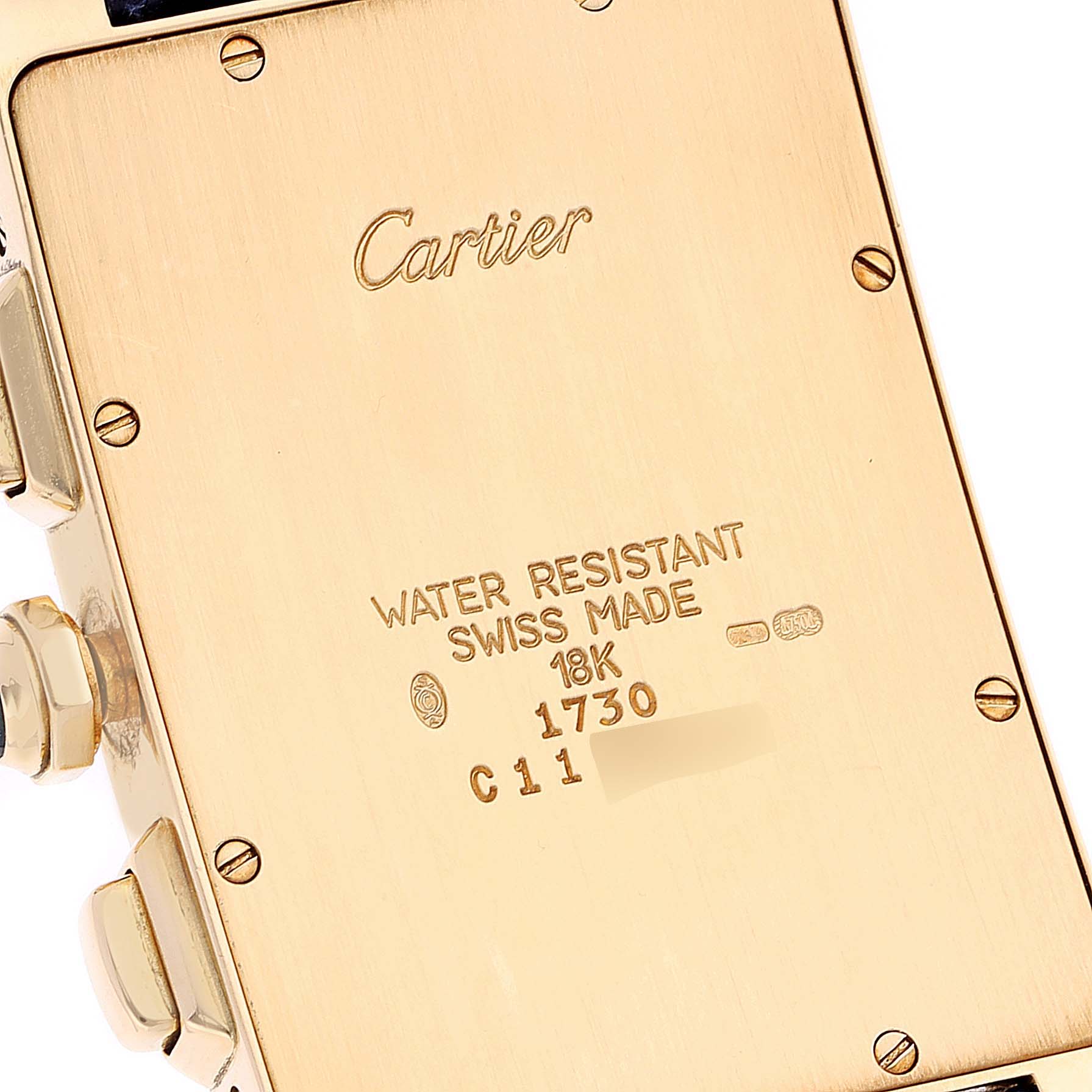 The image shows the back and side detail of the Tank Americaine model by Cartier, highlighting the inscriptions and screws.