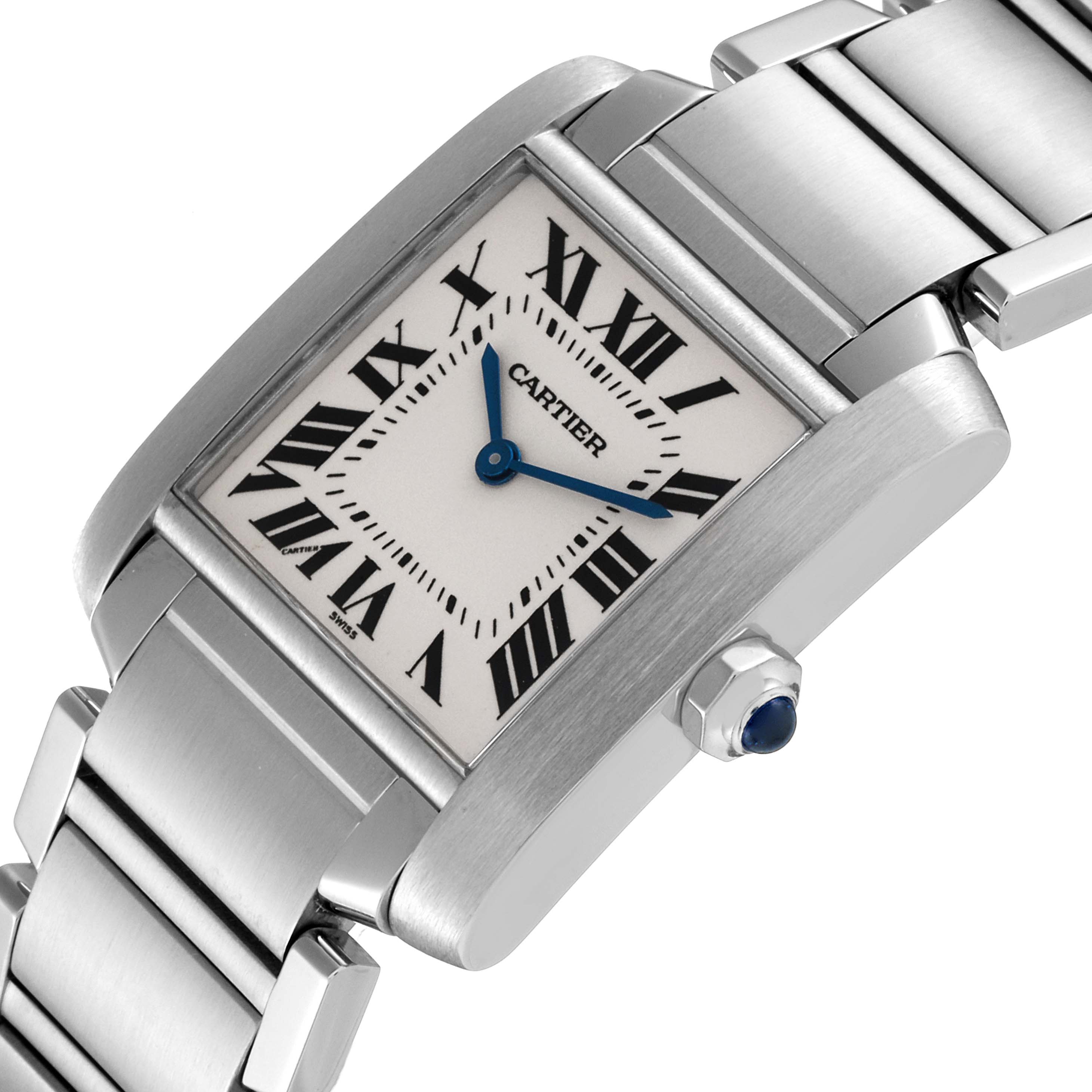 The image shows a side angle of the Cartier Tank Francaise W51003Q3 Women's Stainless Steel Silver Dial W51003Q3 Women's Stainless Steel Silver Dial watch, highlighting its face, bracelet, and crown with a blue gem.