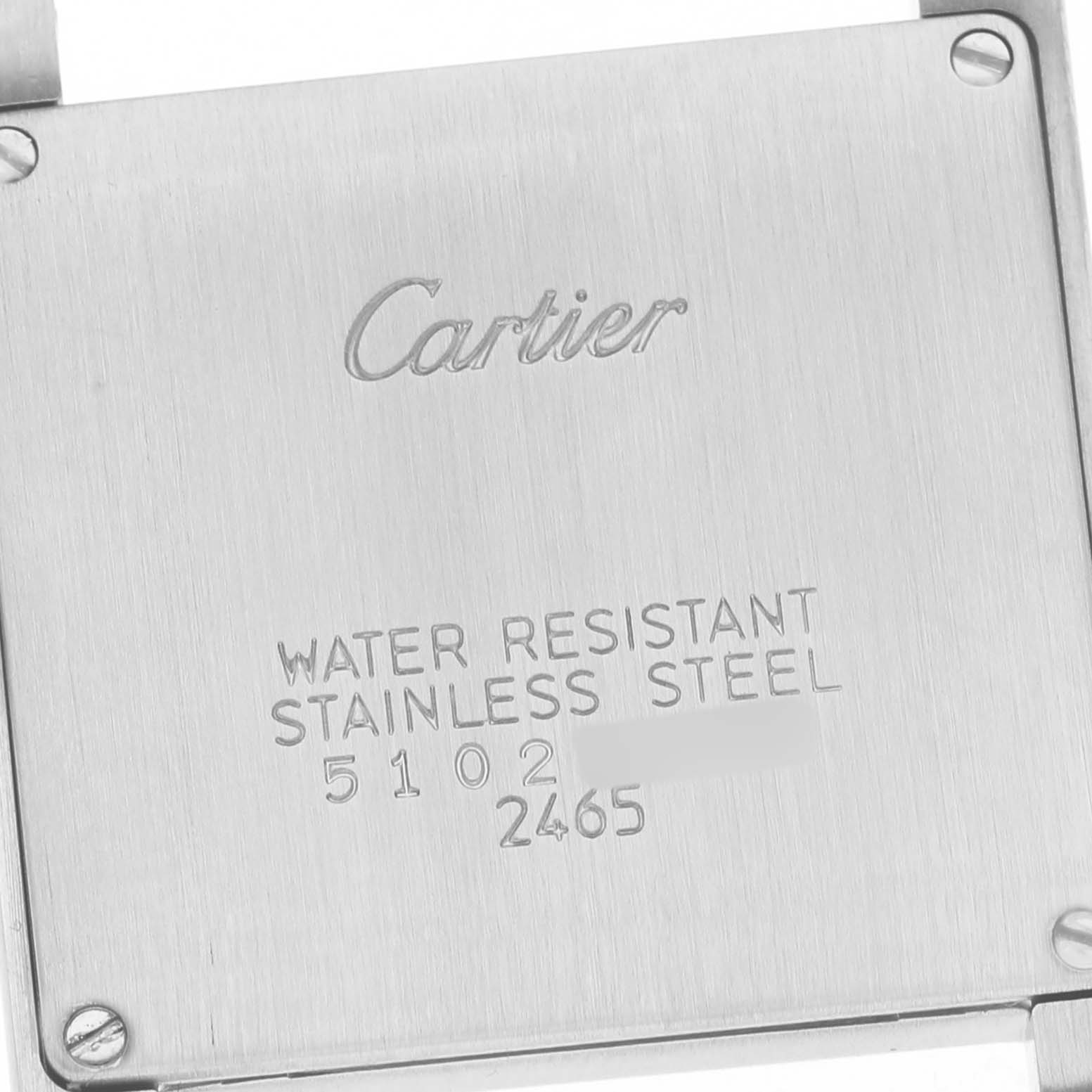 The image shows the back of a Cartier Tank Française watch, highlighting its stainless steel water-resistant feature.