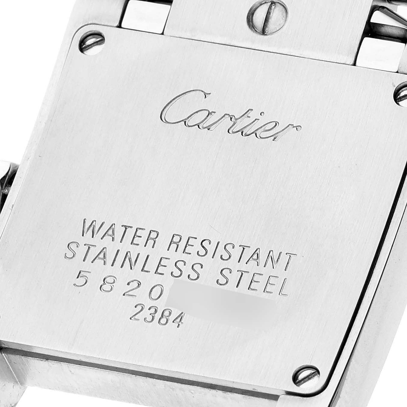 The image shows the backplate of a Cartier Tank Francaise W51028Q3 Women's Stainless Steel Mother of Pearl Dial W51028Q3 Women's Stainless Steel Mother of Pearl Dial watch, displaying the brand name and material details.