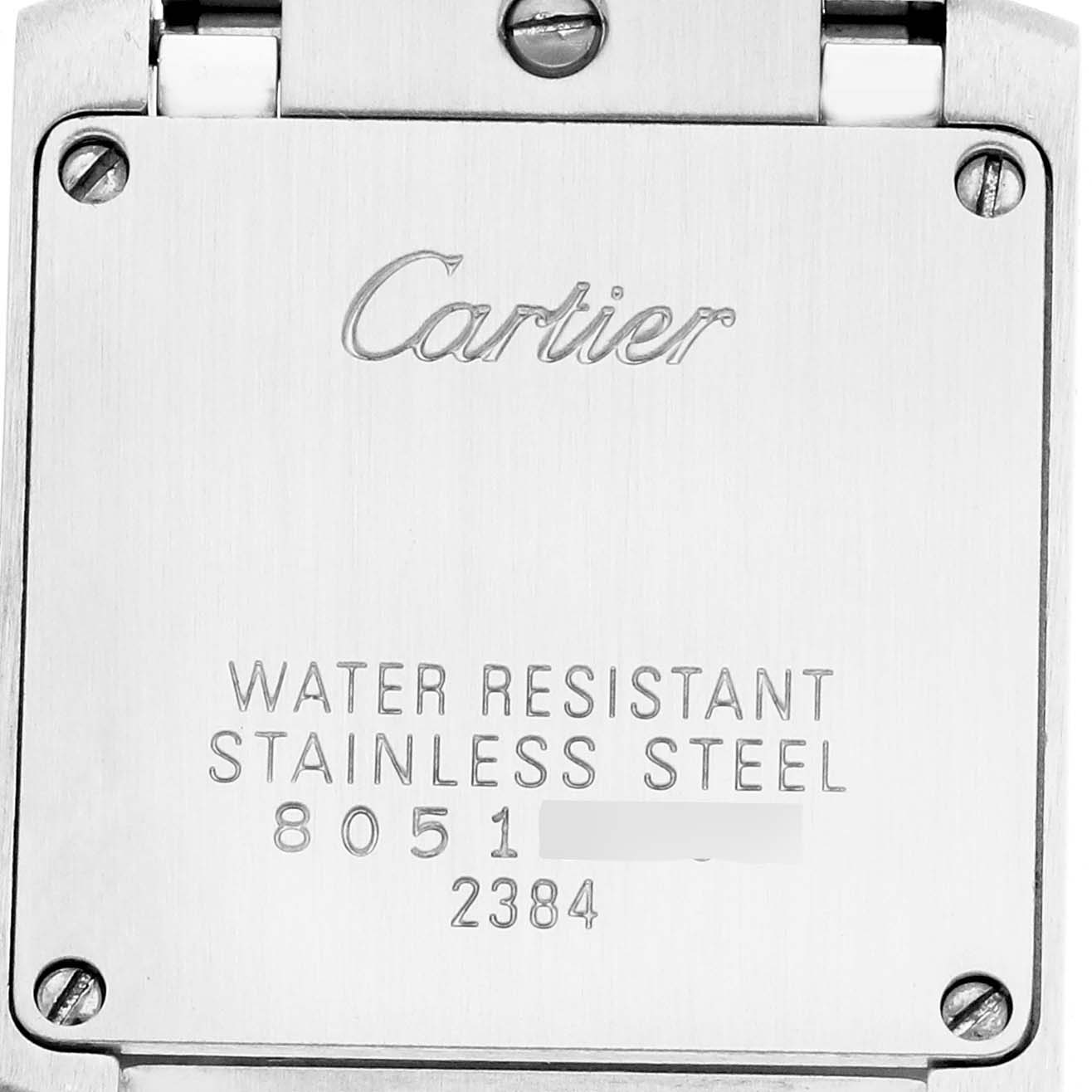 The image shows the back of a Cartier Tank Française watch, highlighting its stainless steel case and engraved details.