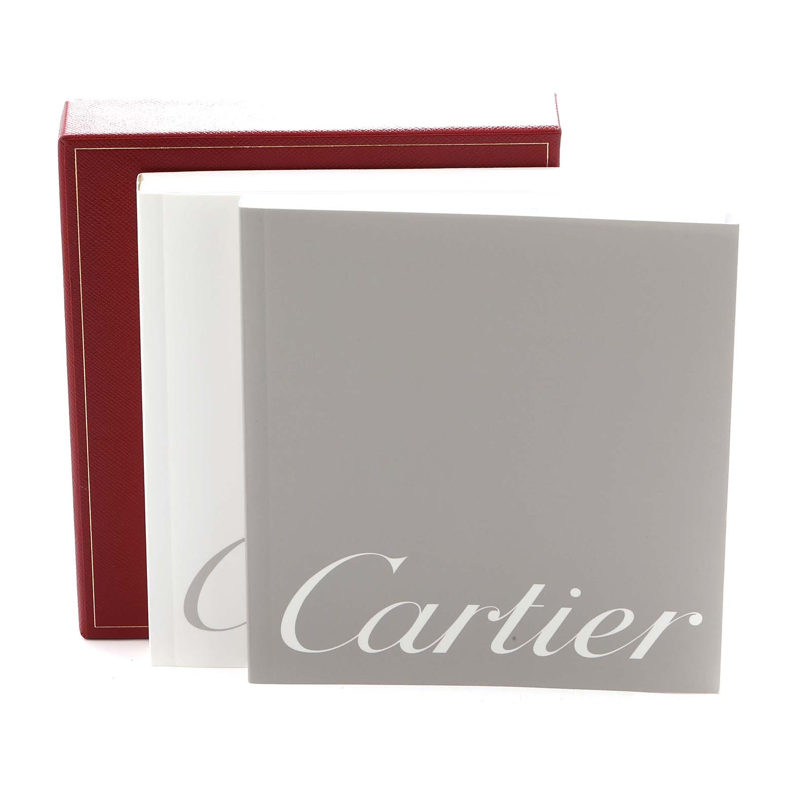 The image shows a Cartier Tank Francaise W51027Q4 Women
s Steel and Gold (two tone) Mother of Pearl Dial box and booklets, viewed from an angle that displays the cover design.