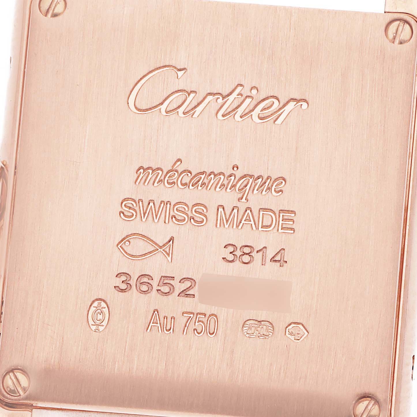 The image shows the back case of a Cartier Tank Louis WGTA0010 Women
s Rose Gold Silver Dial watch, featuring engraving and the brand
s markings.