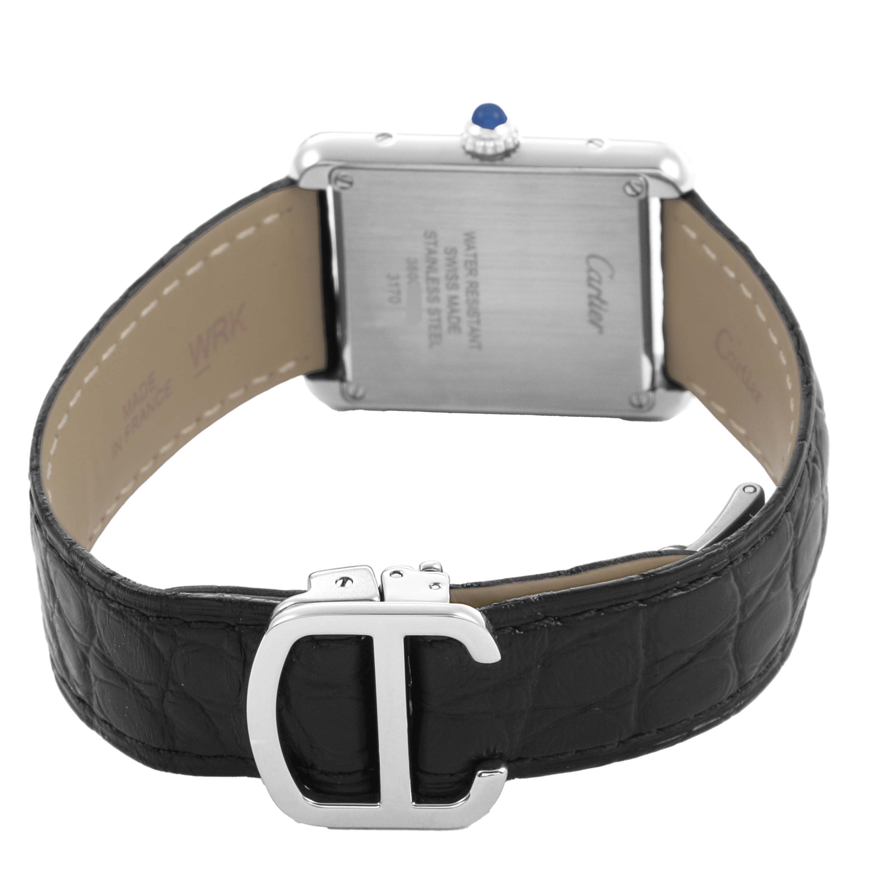 The image shows the back of the Cartier Tank Solo WSTA0030 Women's Stainless Steel Silver Dial watch, highlighting the case back, leather strap, and buckle.
