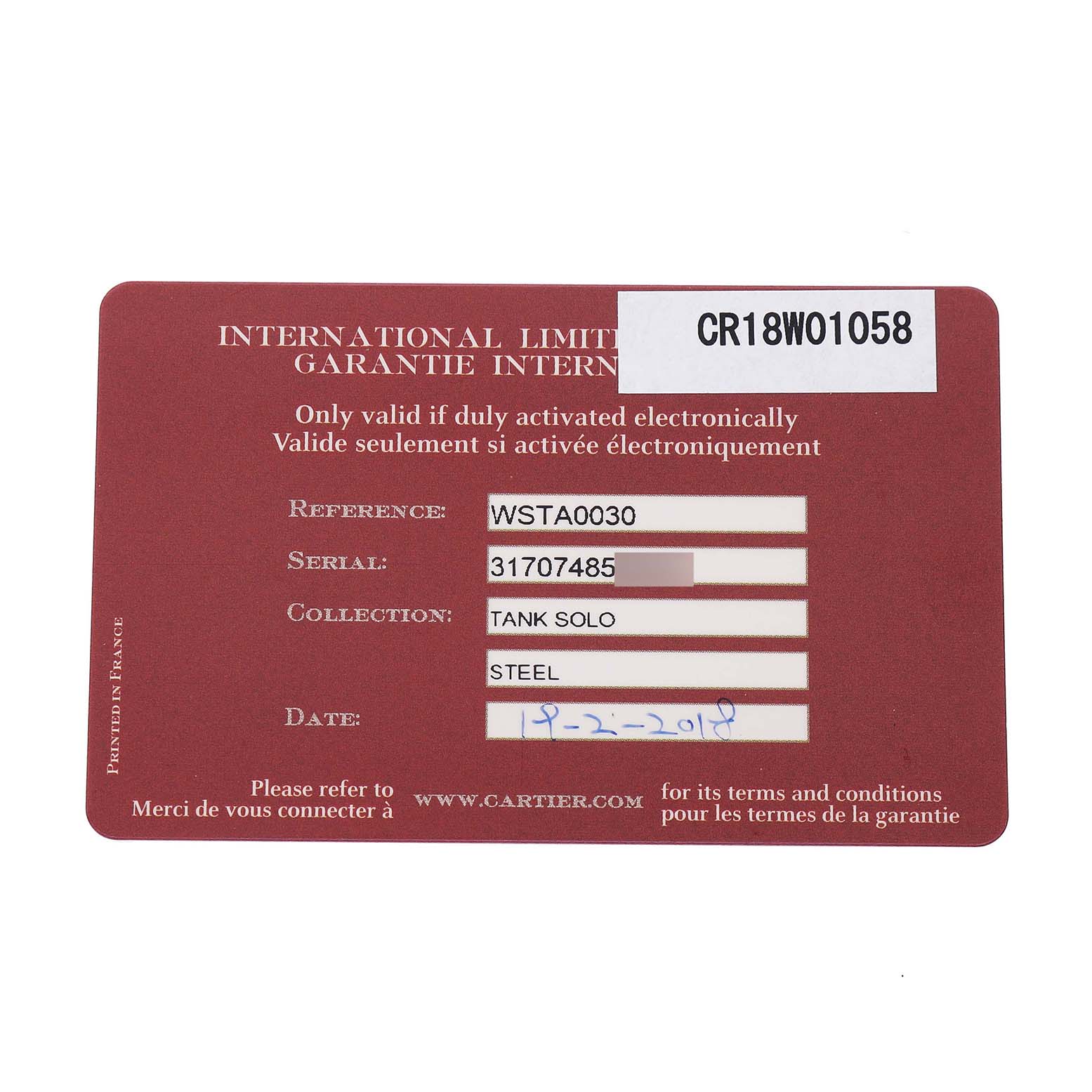 The image shows the warranty card for a Cartier Tank Solo WSTA0030 Women's Stainless Steel Silver Dial watch, displaying reference and serial numbers.