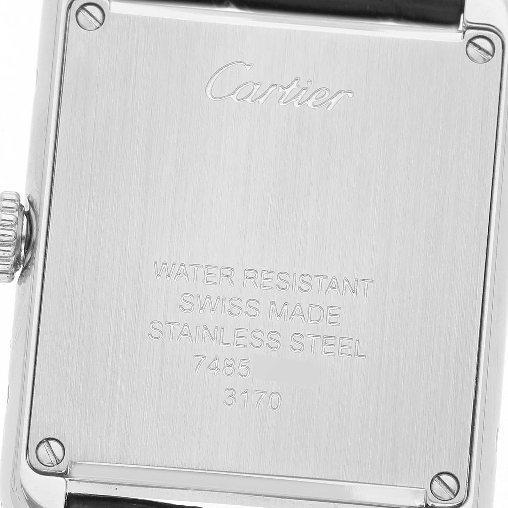 The image shows the back of a Cartier Tank Solo WSTA0030 Women's Stainless Steel Silver Dial watch, highlighting the engraved details and case screws.