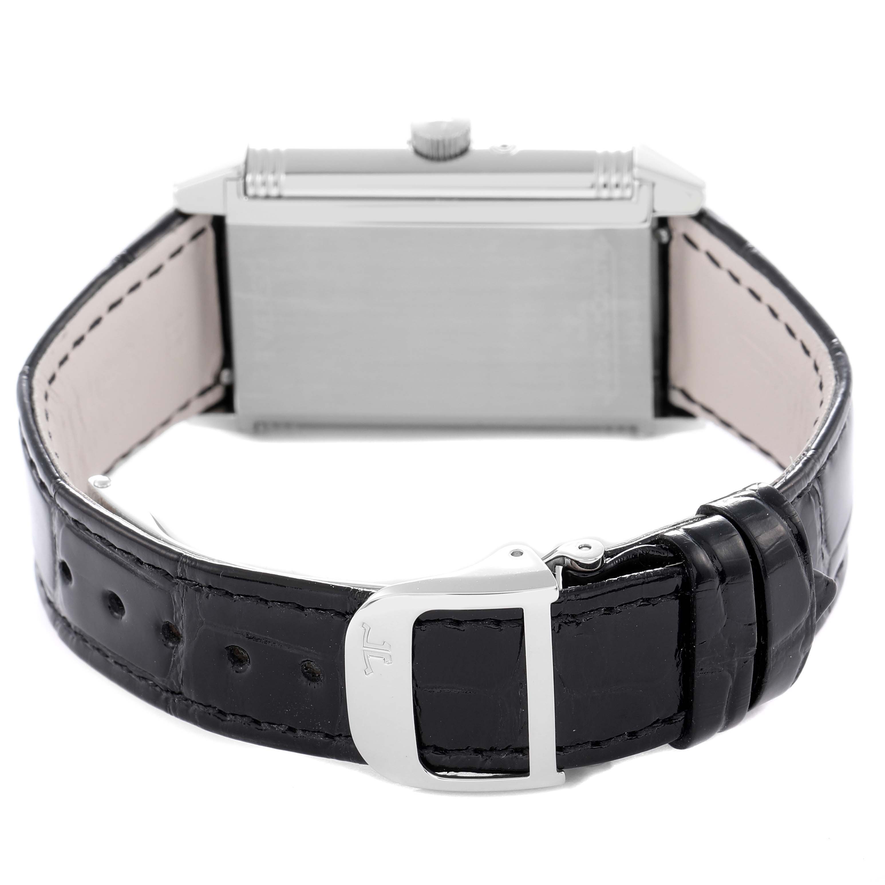 The image shows the back of a Jaeger-LeCoultre Reverso watch, highlighting the strap and buckle.