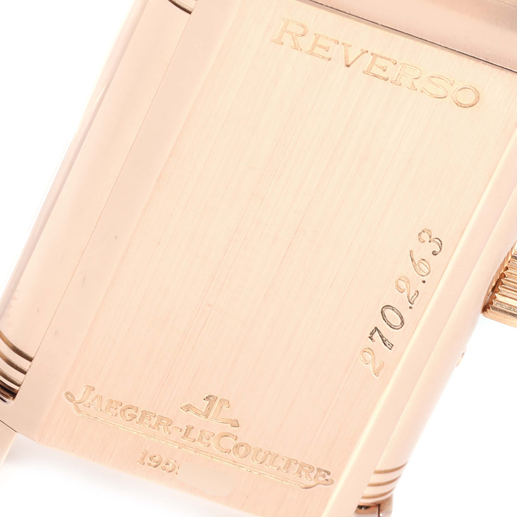 This image shows a close-up of the back of the Jaeger-LeCoultre Reverso watch, highlighting the inscriptions and model number.