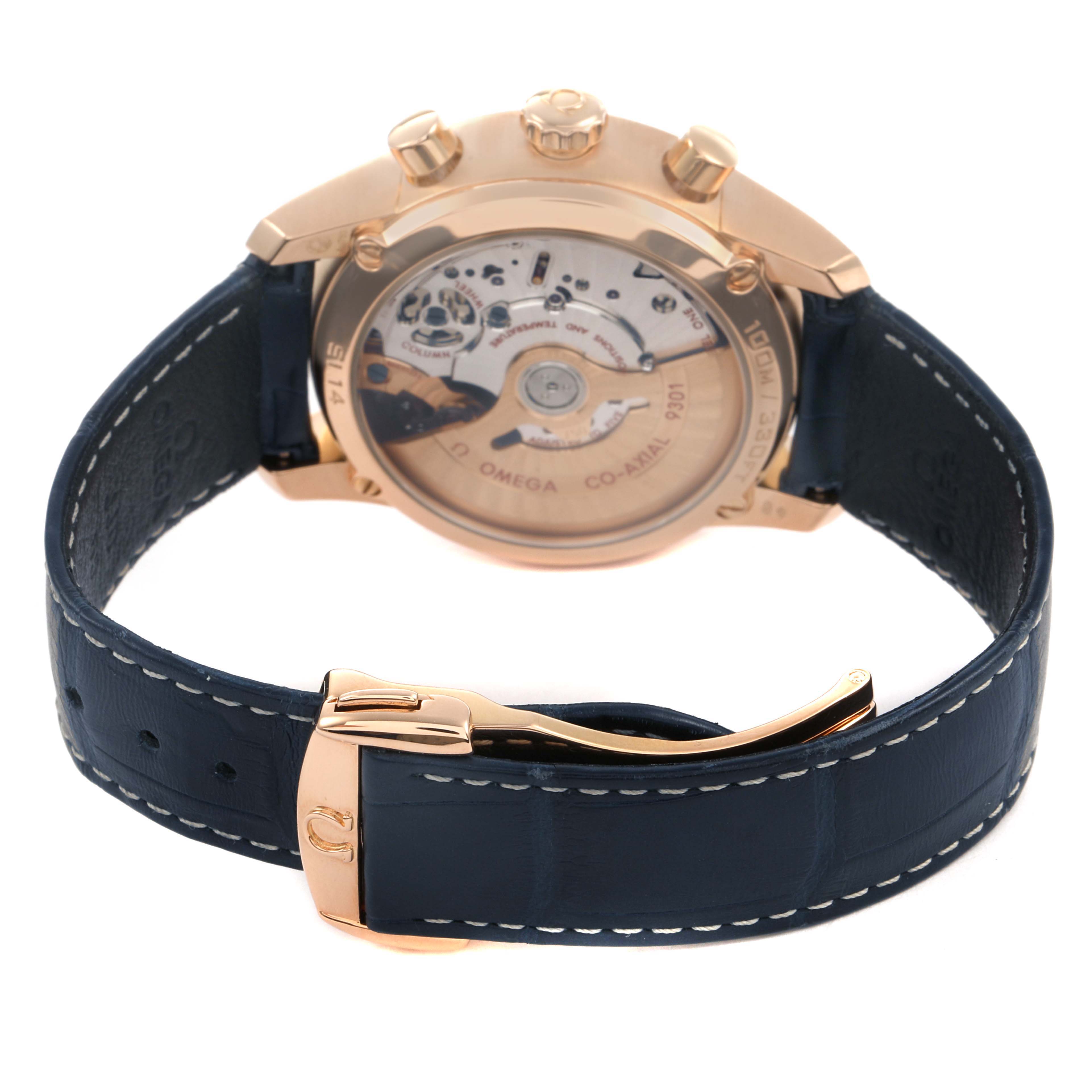 The Omega De Ville 83149 Men's Rose Gold Blue Dial watch is shown from a rear angle, highlighting its transparent case back and blue leather strap.