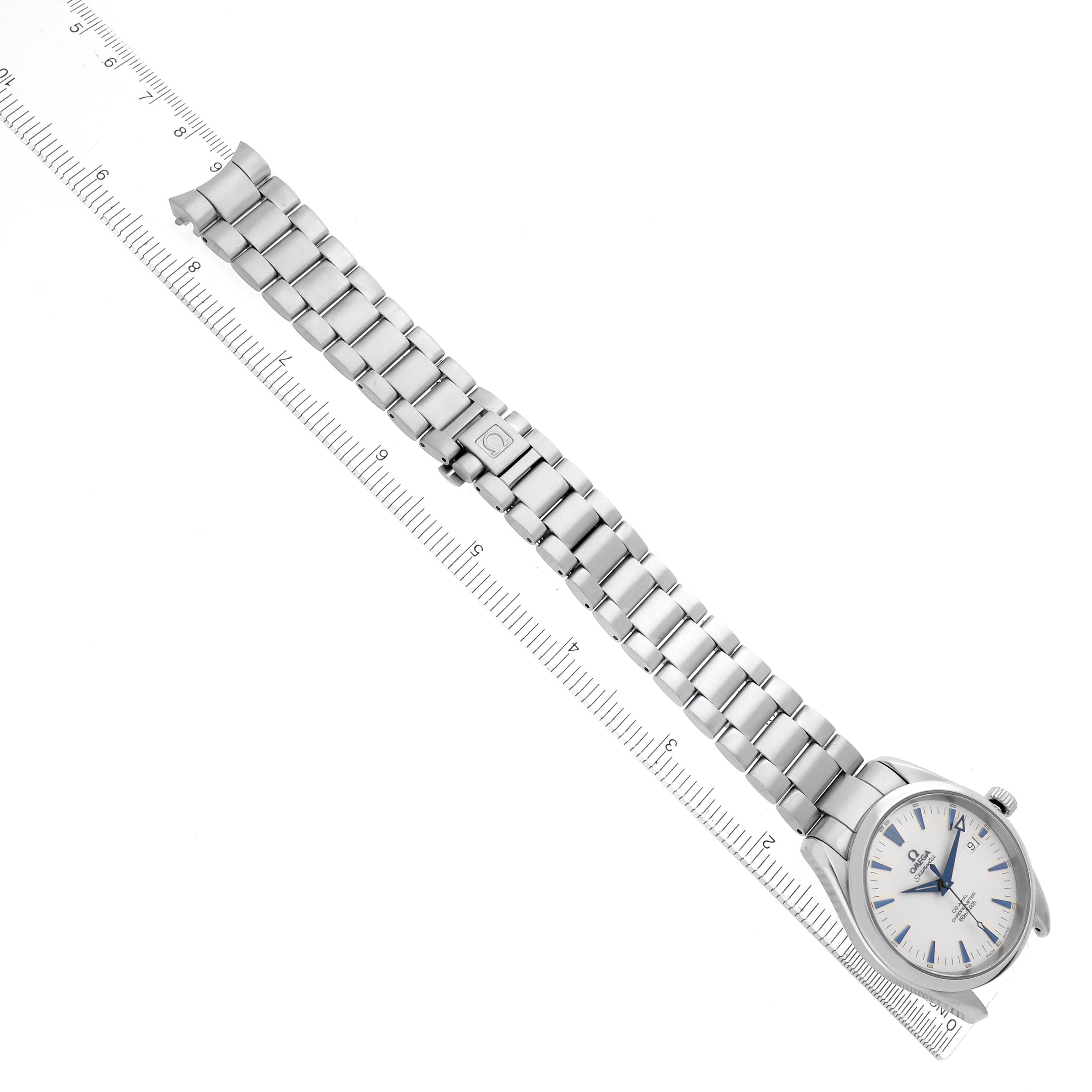 The Omega Seamaster 2503.33.00 Men
s Stainless Steel Silver Dial watch is shown from a top-down angle, highlighting its metal bracelet and face alongside a ruler for sizing reference.