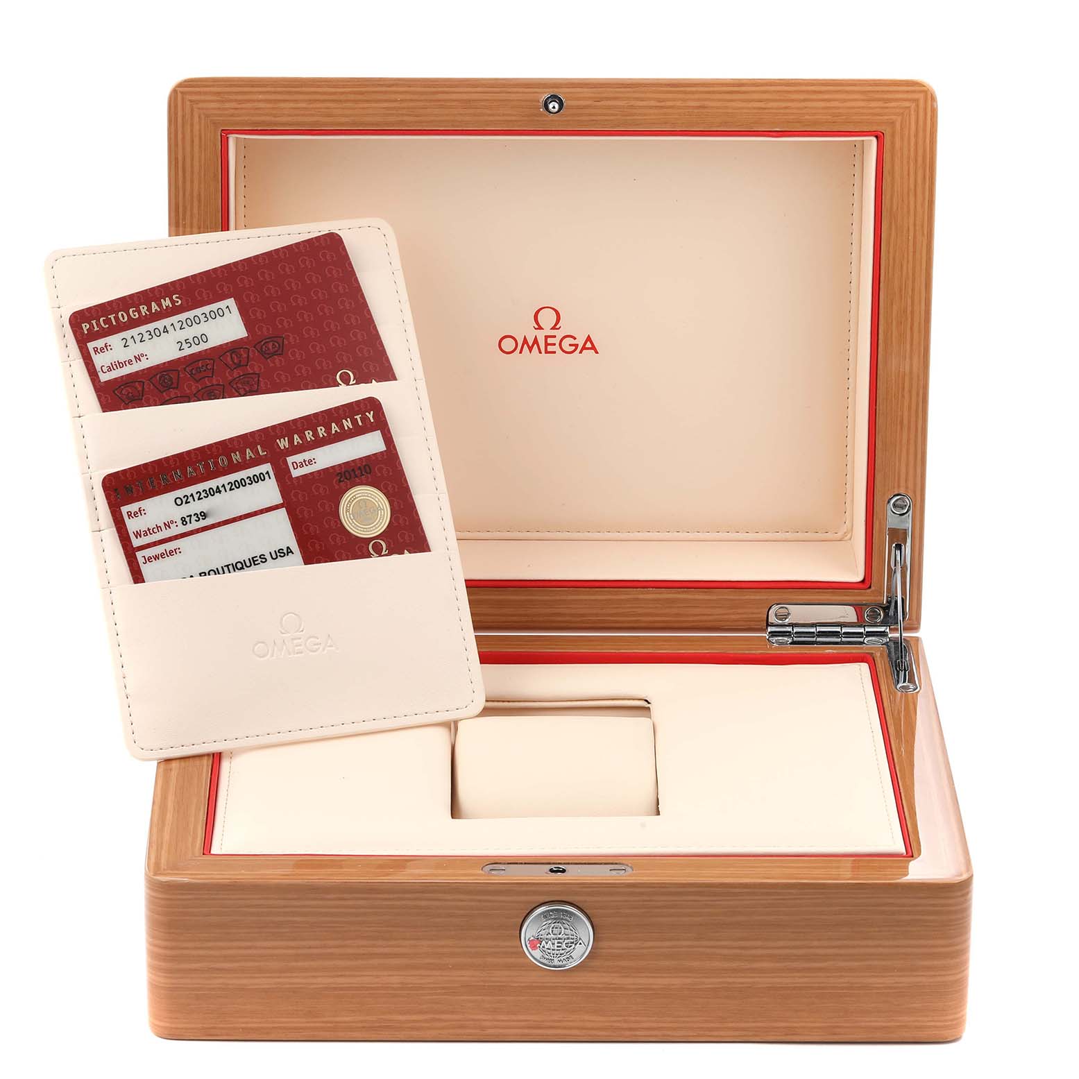 The Seamaster by Omega is shown with its open wooden box and warranty cards.