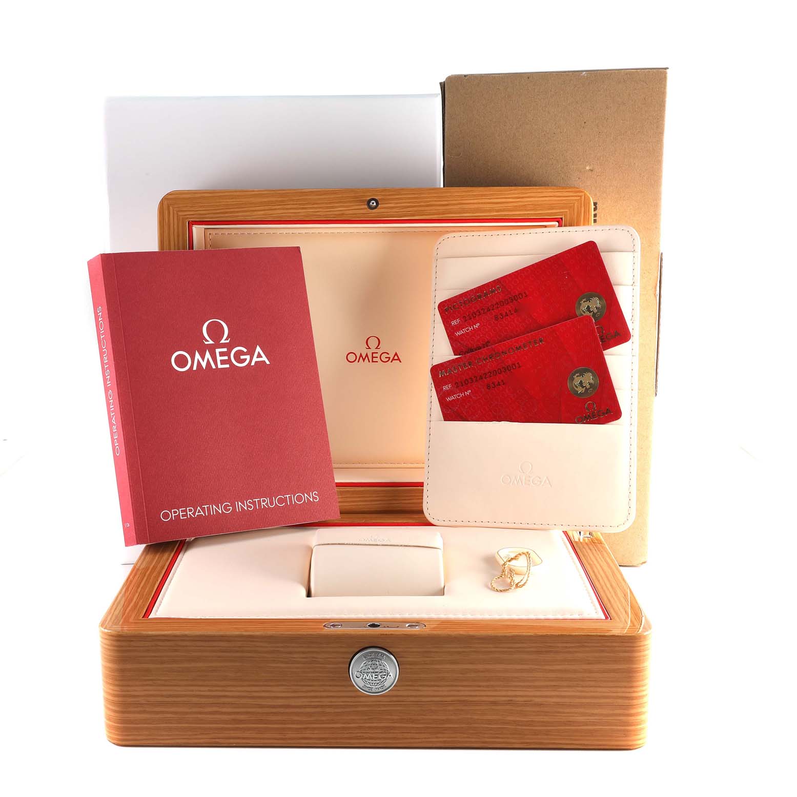 The image shows the Omega Seamaster 210.32.42.20.03.001 Men
s Stainless Steel Blue Dial 210.32.42.20.03.001 Men
s Stainless Steel Blue Dial watch box, operating instructions, and warranty cards from a front-facing angle.