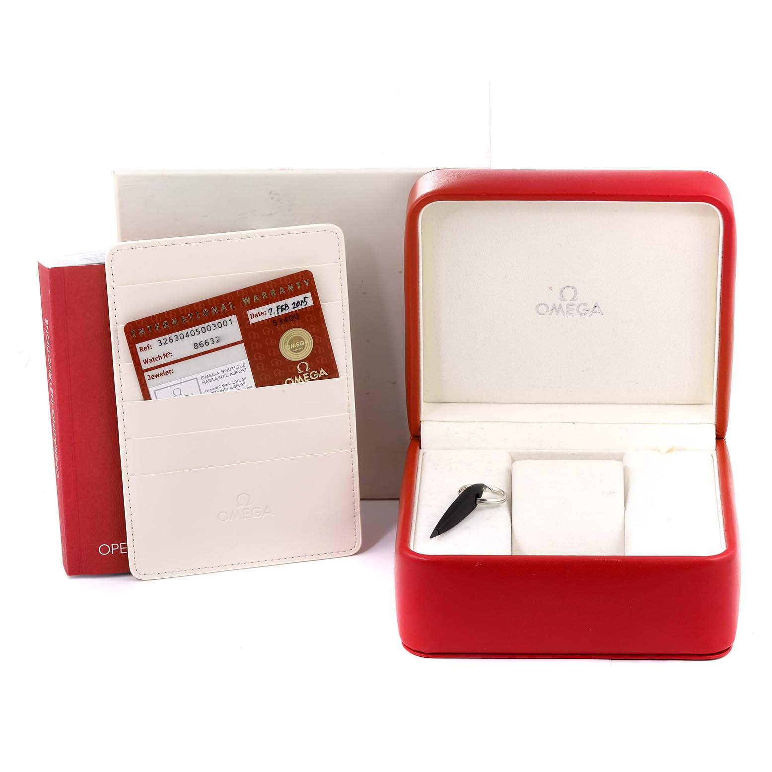 The image shows the packaging of an Omega Speedmaster 326.30.40.50.03.001 Men's Stainless Steel Blue Dial 326.30.40.50.03.001 Men's Stainless Steel Blue Dial, including an open watch box, warranty card, and instruction booklet.