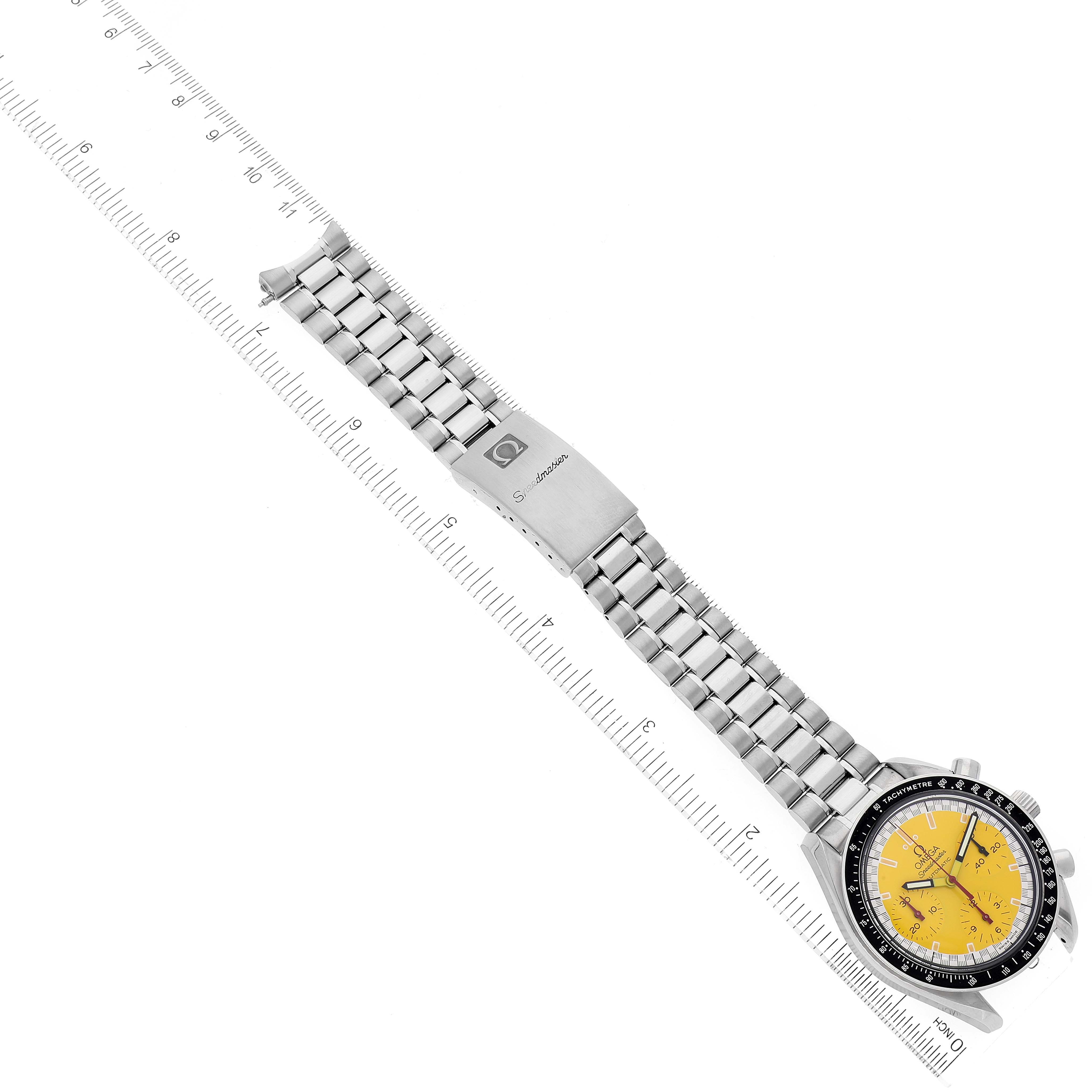The Omega Speedmaster 3510.12.00 Men's Stainless Steel Yellow Dial 3510.12.00 Men's Stainless Steel Yellow Dial watch is shown from an above angle, displaying the entire band, clasp, and watch face with a yellow dial.