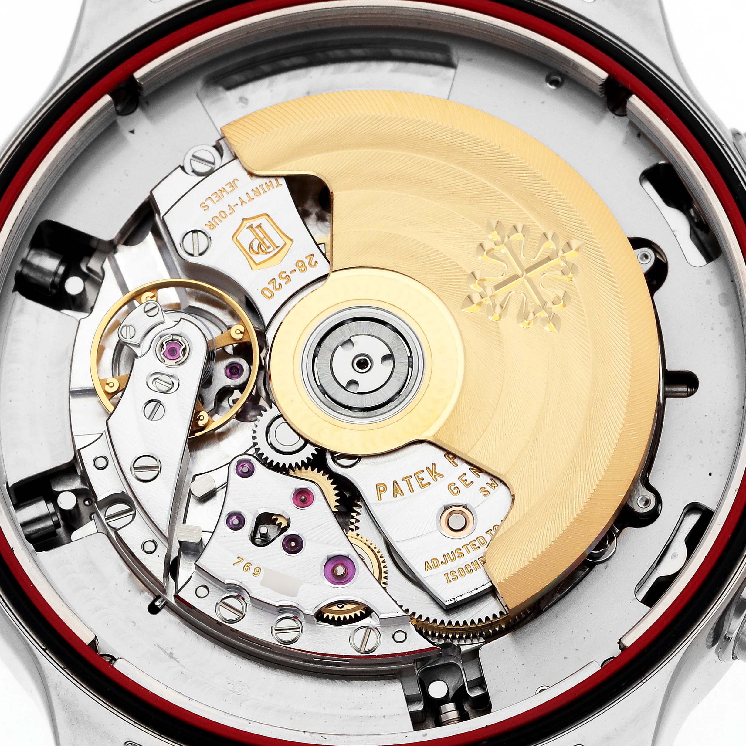 The image shows the movement of a Patek Philippe Calatrava 5924G-001 Men
s White Gold Blue Dial, highlighting the intricate gears and rotor from a top-down perspective.