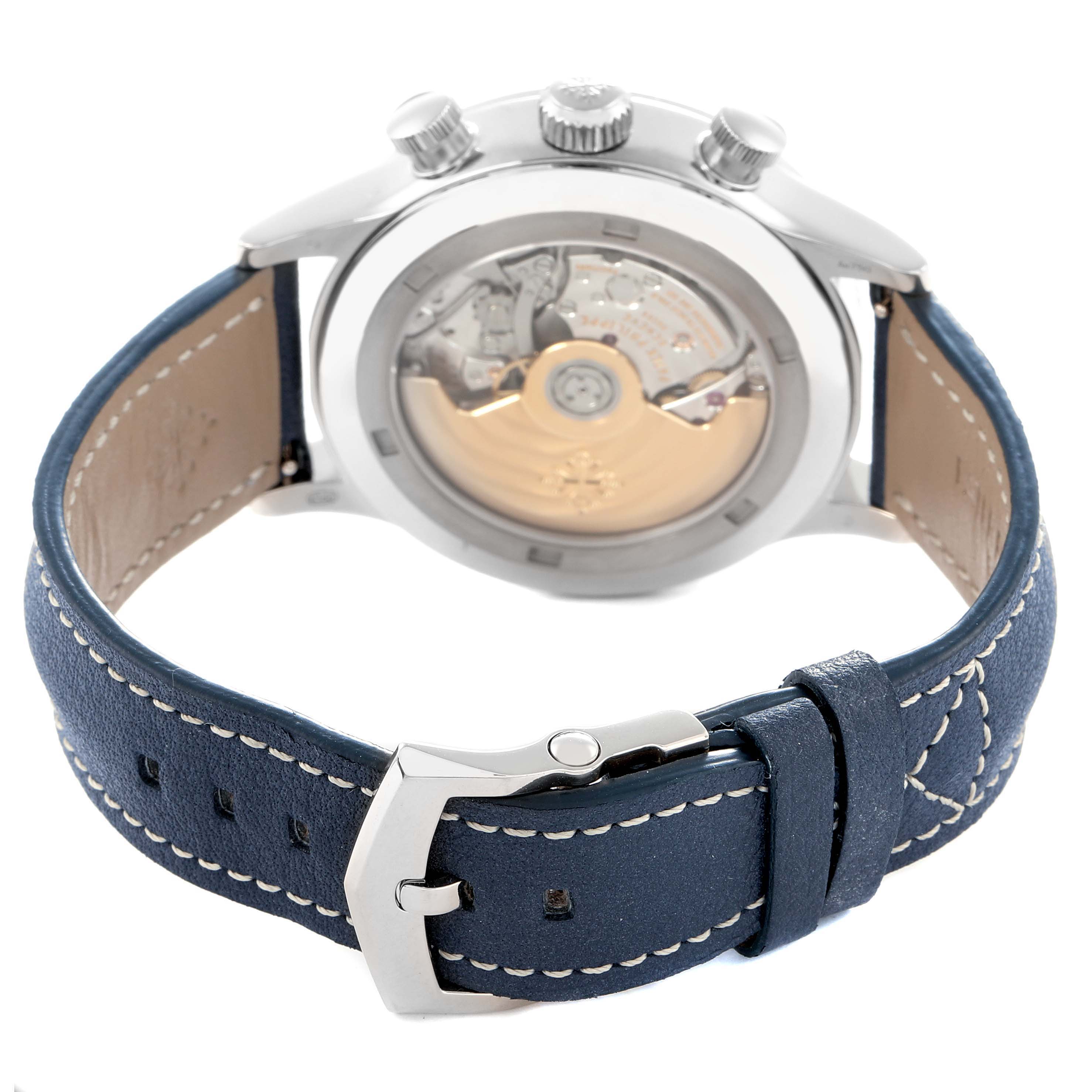 The Patek Philippe Calatrava 5924G-001 Men
s White Gold Blue Dial watch is shown from the back, displaying its mechanical movement and blue leather strap.