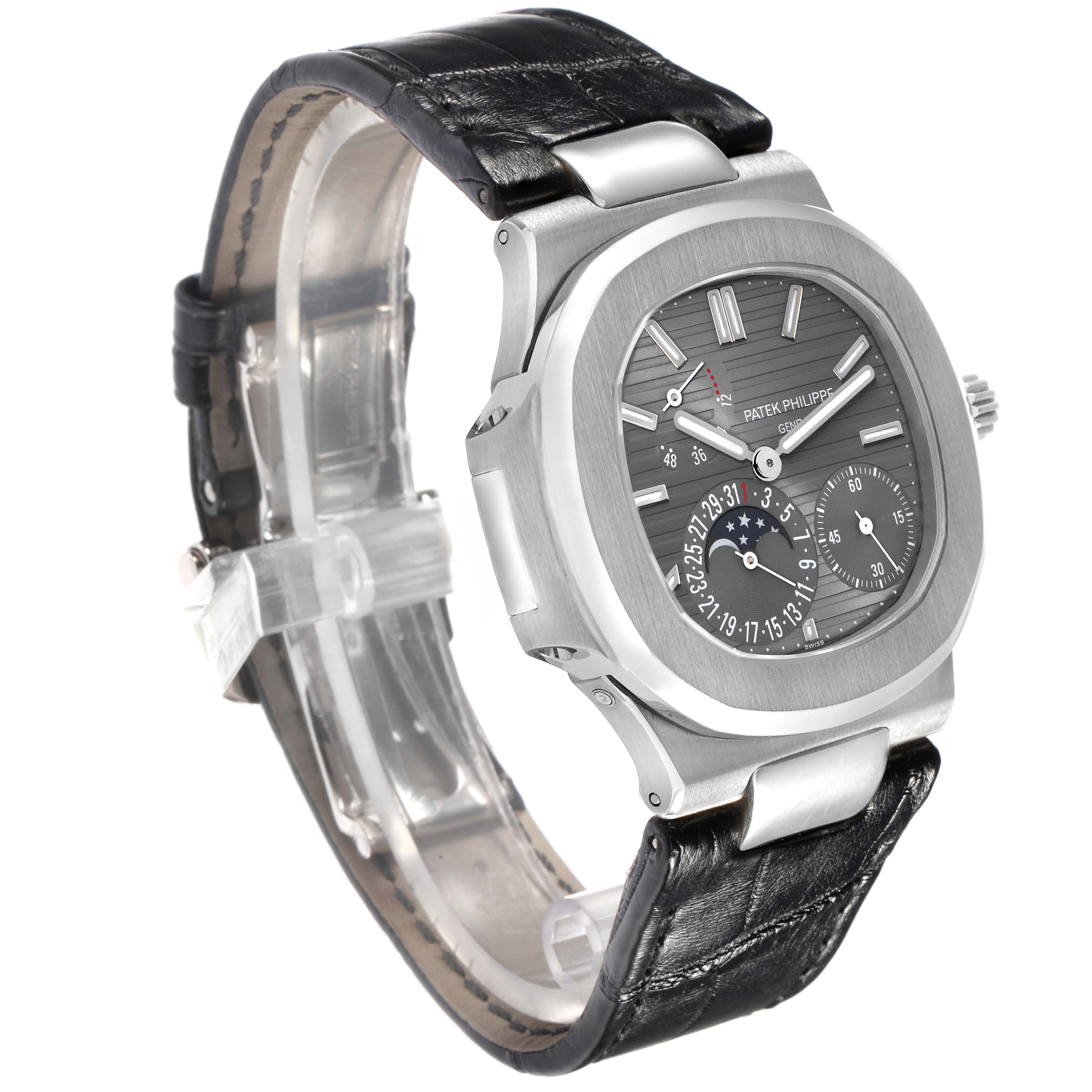 The Patek Philippe Nautilus 5712G Men
s White Gold Grey Dial watch is shown at a slight angle, displaying its face, bezel, and leather strap.