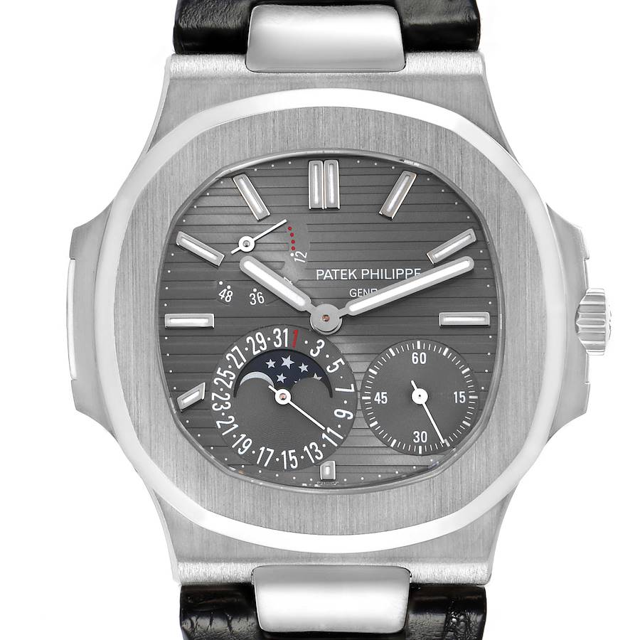 The image shows a front view of the Patek Philippe Nautilus 5712G men's watch, highlighting its gray dial with complications and a leather strap.