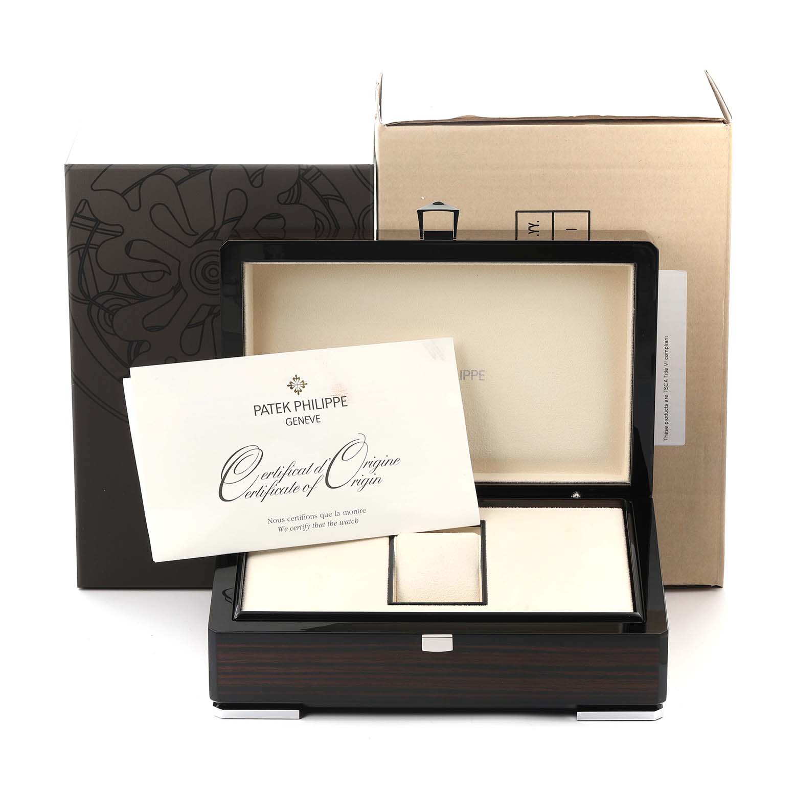 The image shows a Patek Philippe Nautilus 5712G Men
s White Gold Grey Dial watch box, certificate of origin, and packaging, viewed from the front.