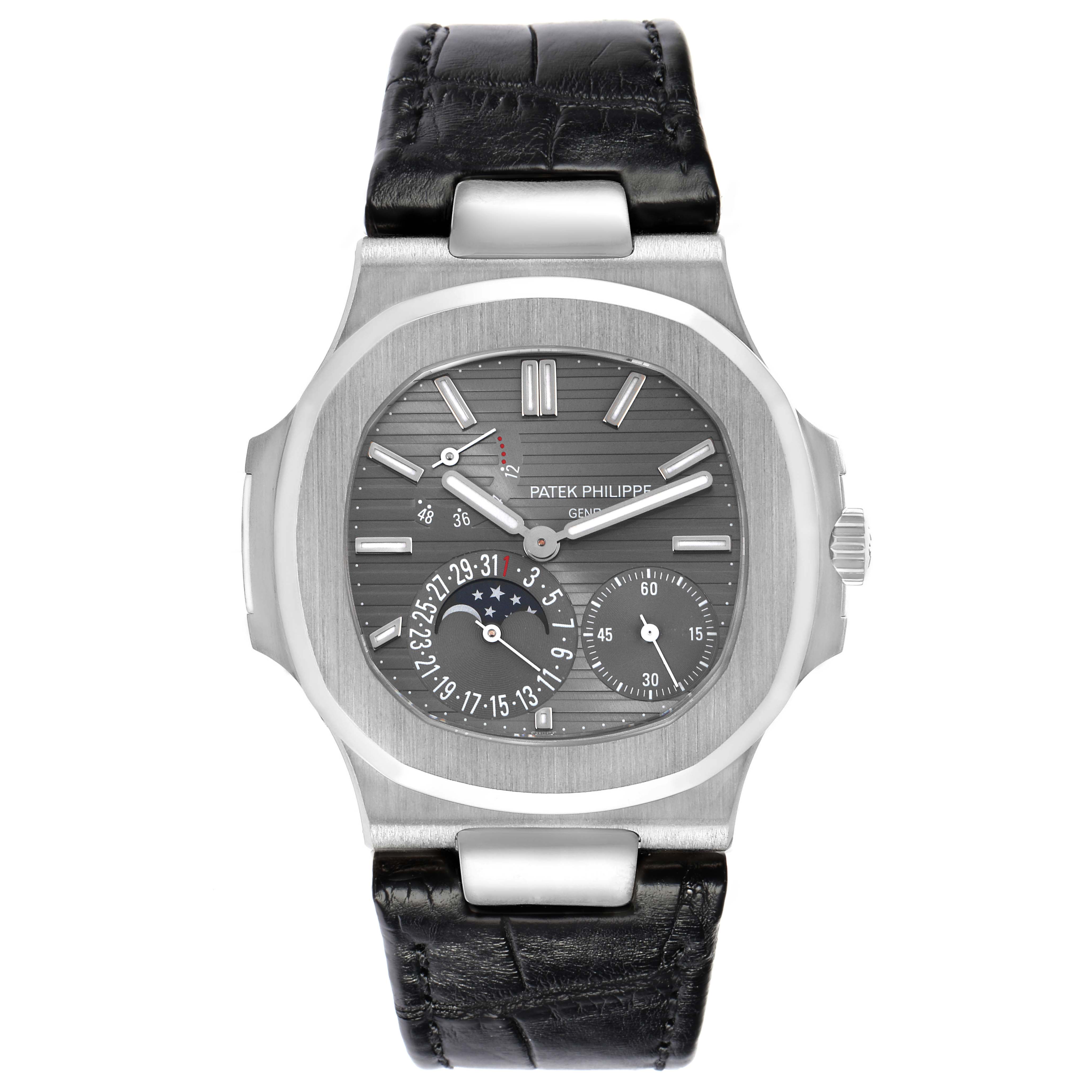 The Patek Philippe Nautilus 5712G Men
s White Gold Grey Dial watch is shown from a front angle, displaying its face, bezel, and leather strap.