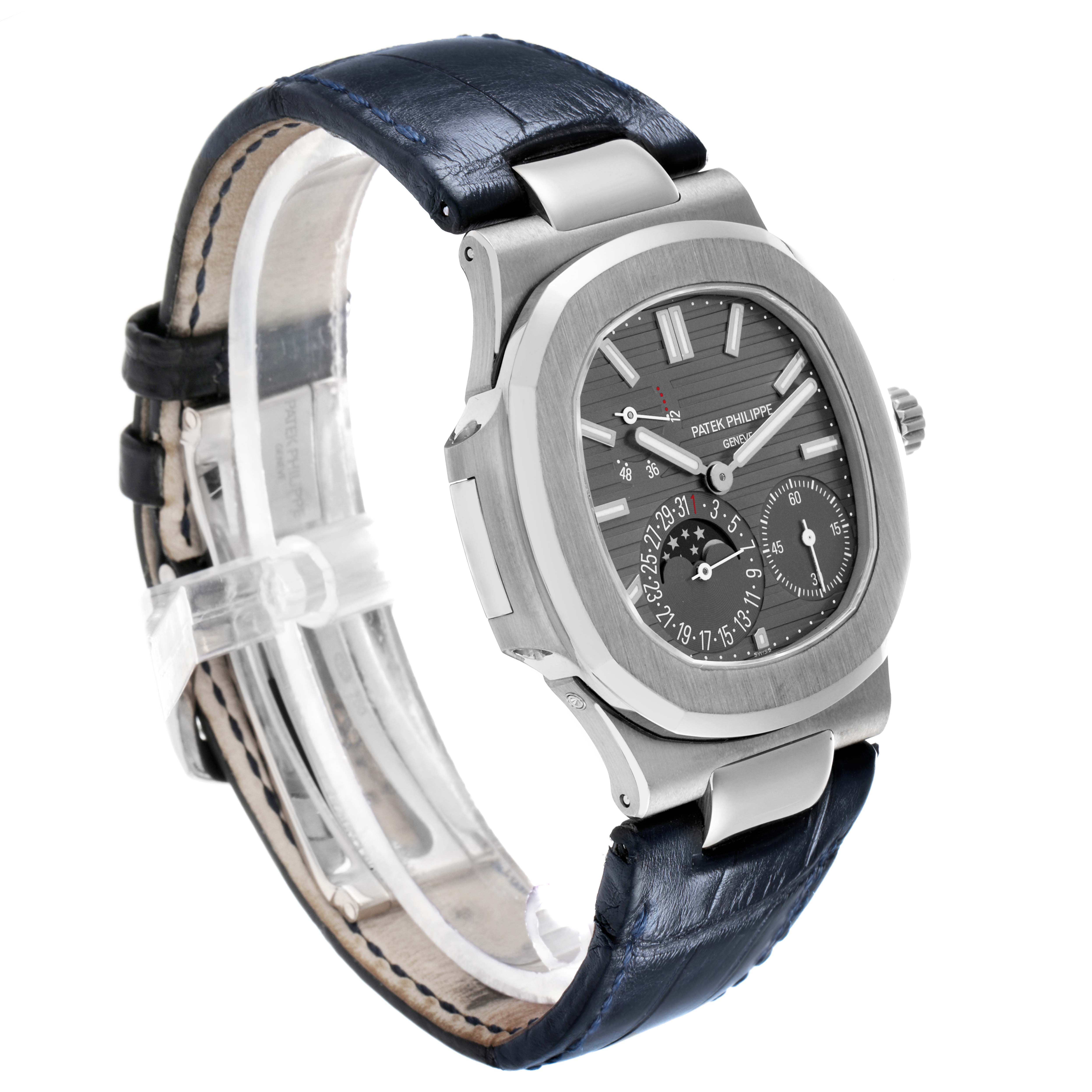 The Patek Philippe Nautilus 5712G Men's White Gold Grey Dial watch is shown from a three-quarter angle, highlighting the dial, case, and leather strap.