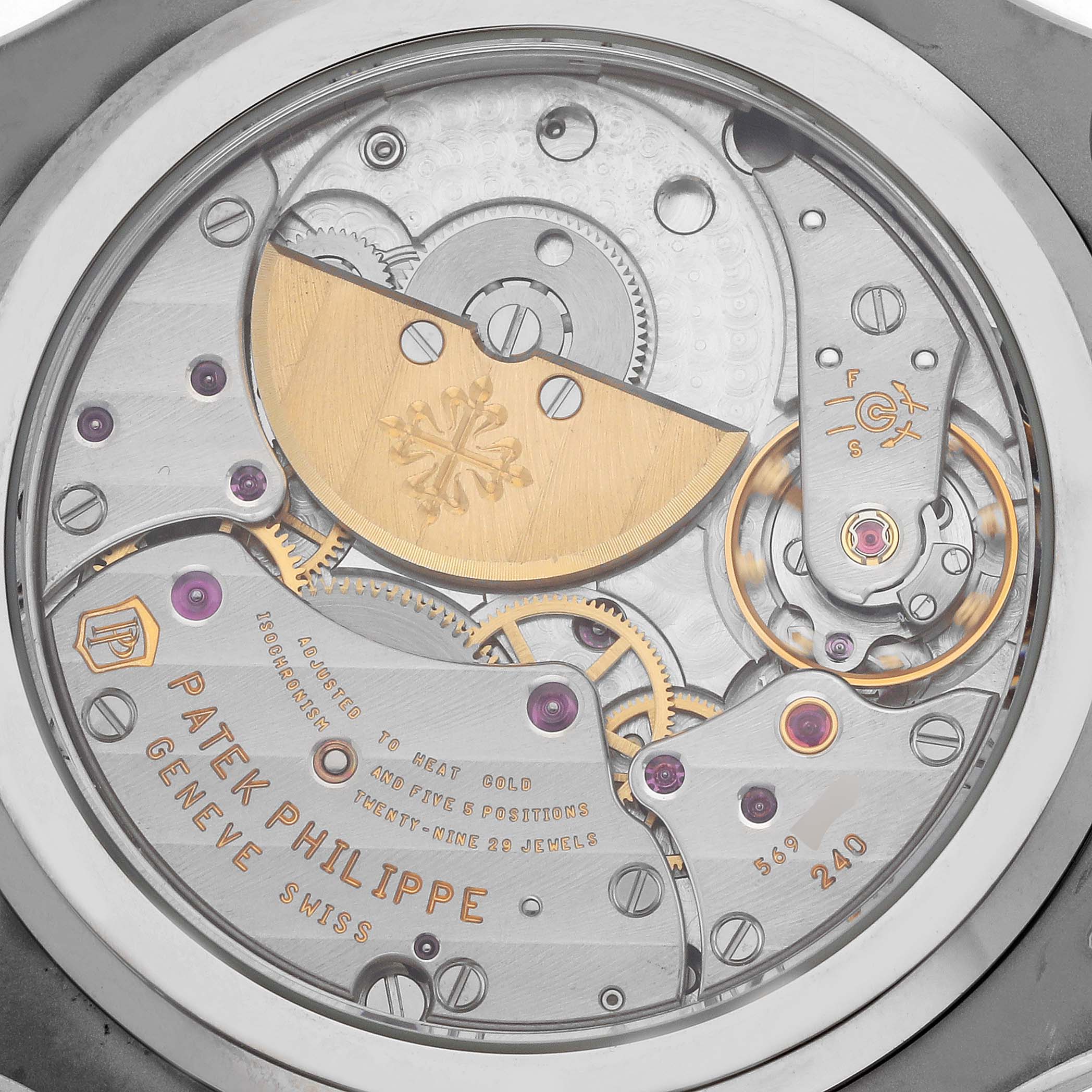 The image shows the back view of a Patek Philippe Nautilus 5712G Men's White Gold Grey Dial, highlighting the movement and intricate mechanical details.