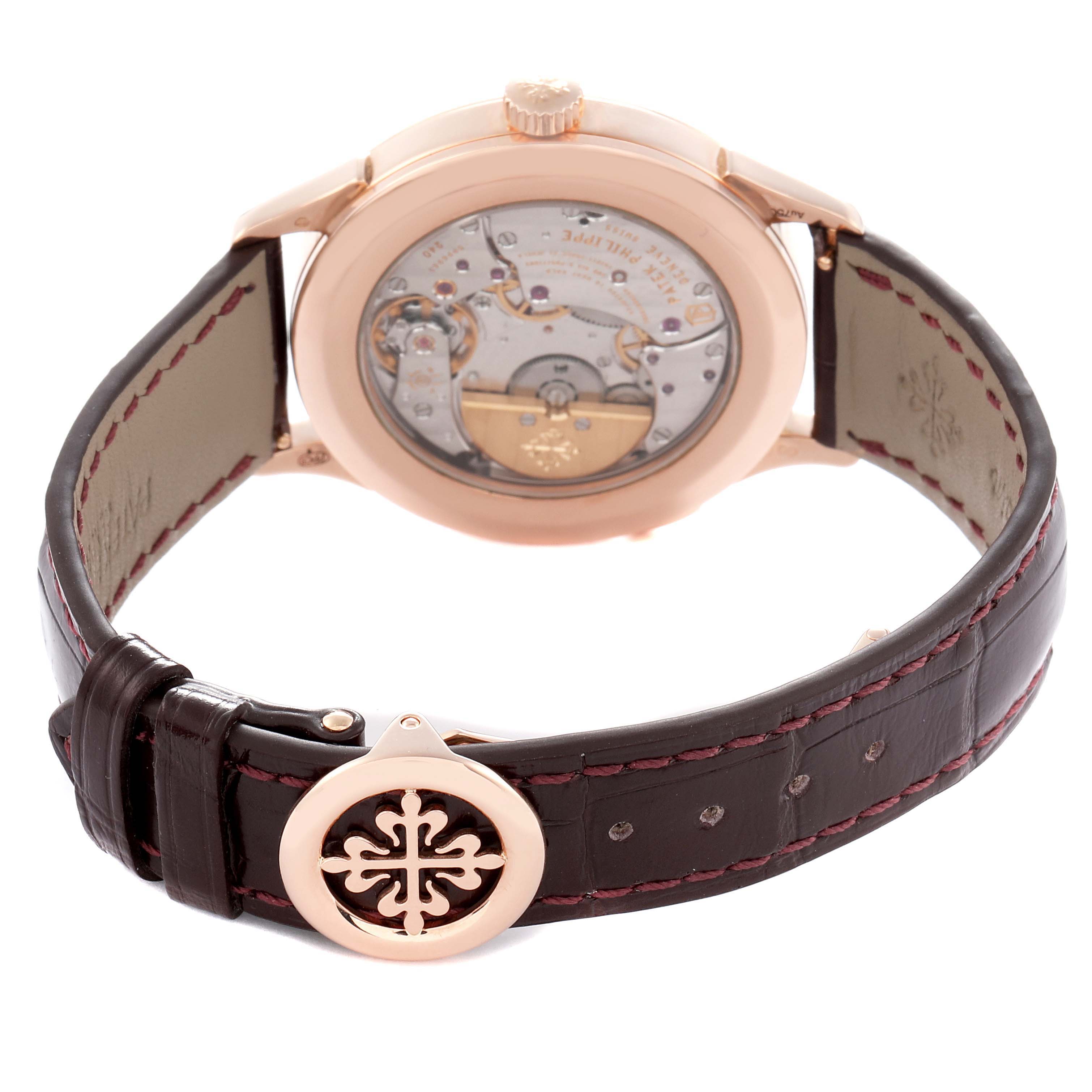 The Patek Philippe Complications 5230R-001 Men
s Rose Gold Grey Dial watch is shown from the back, displaying the mechanical movement and part of the strap and clasp.